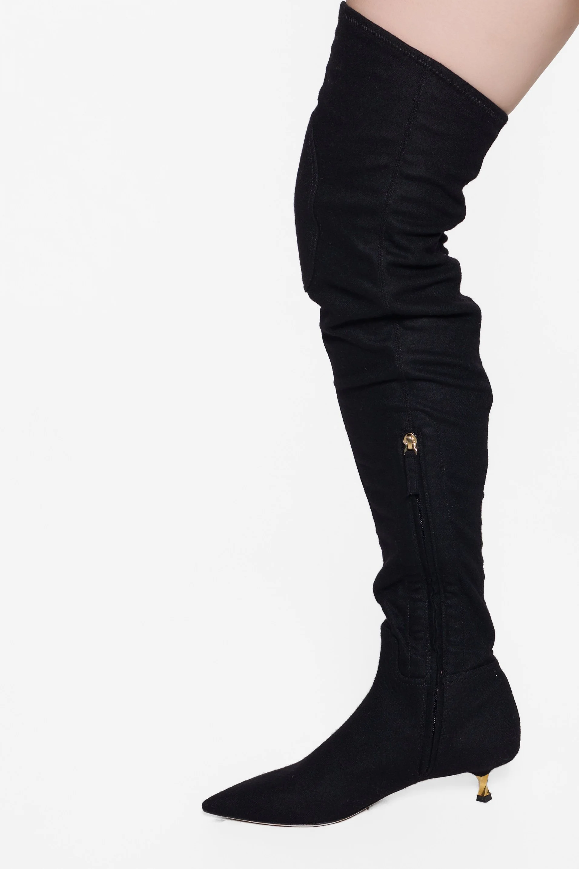 Black designer thigh boots with fitted leg and padded knee detailing