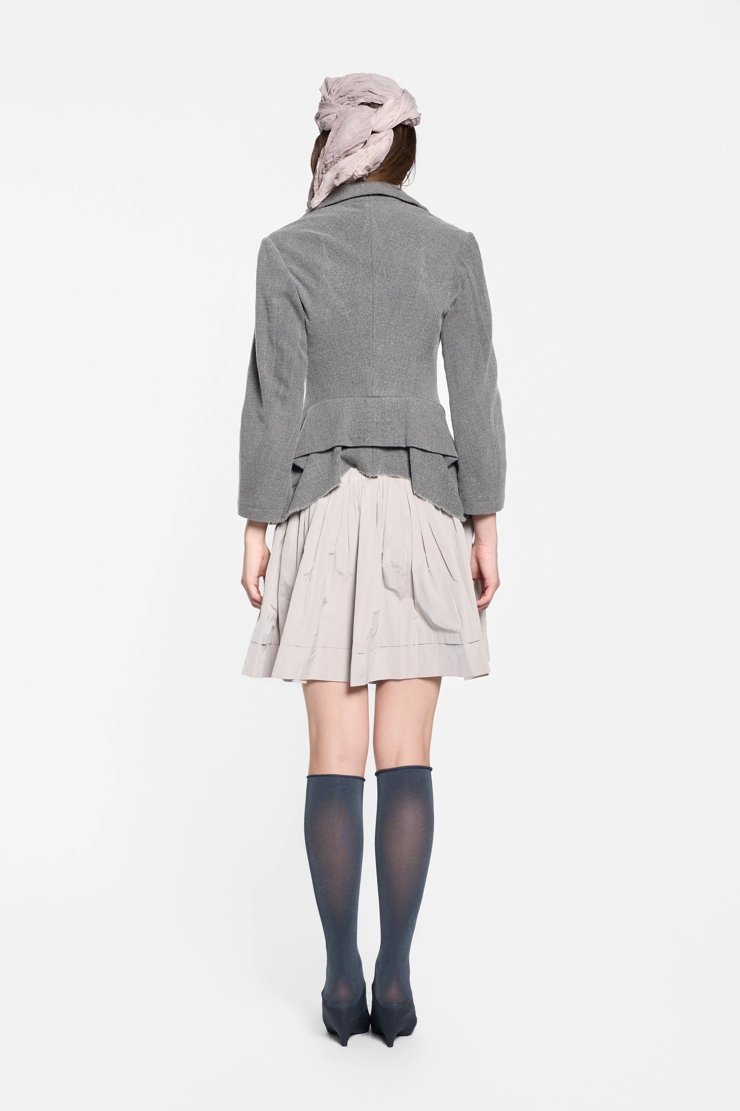Back view of Junya Watanabe deconstructed jacket with layered panels