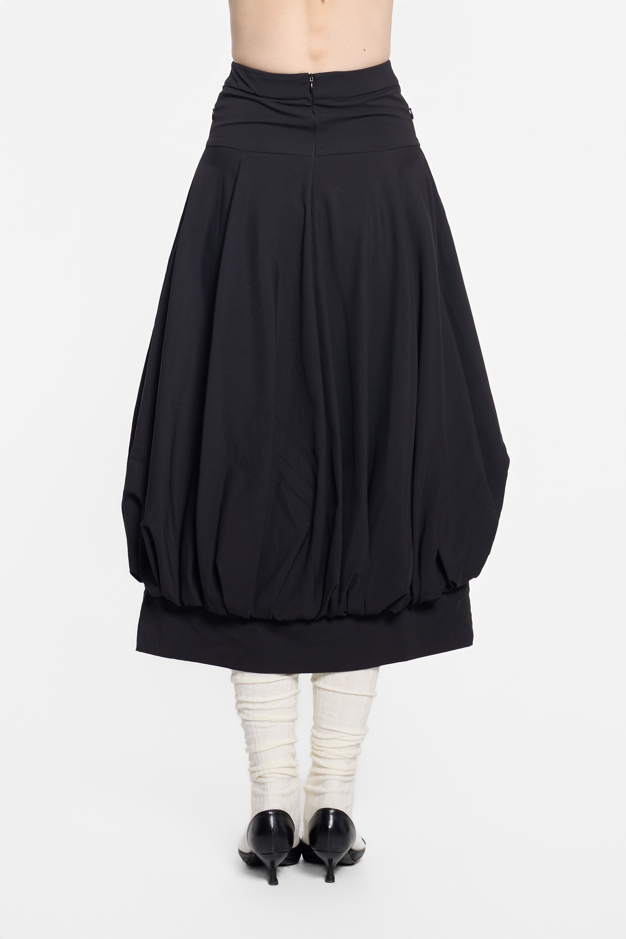 Back view of UN3D black gathered skirt