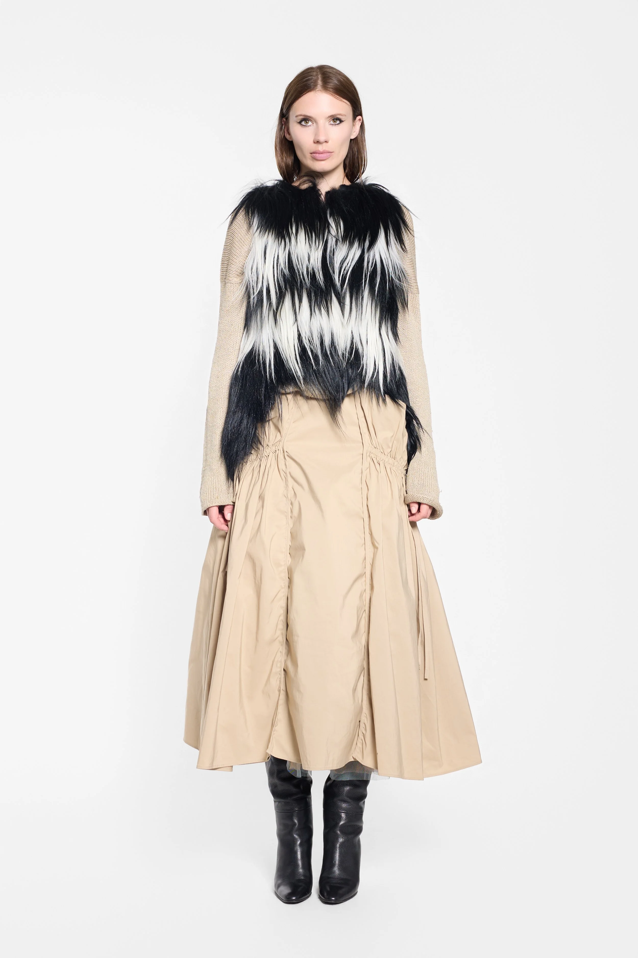 Front view of black and white goat fur gilet
