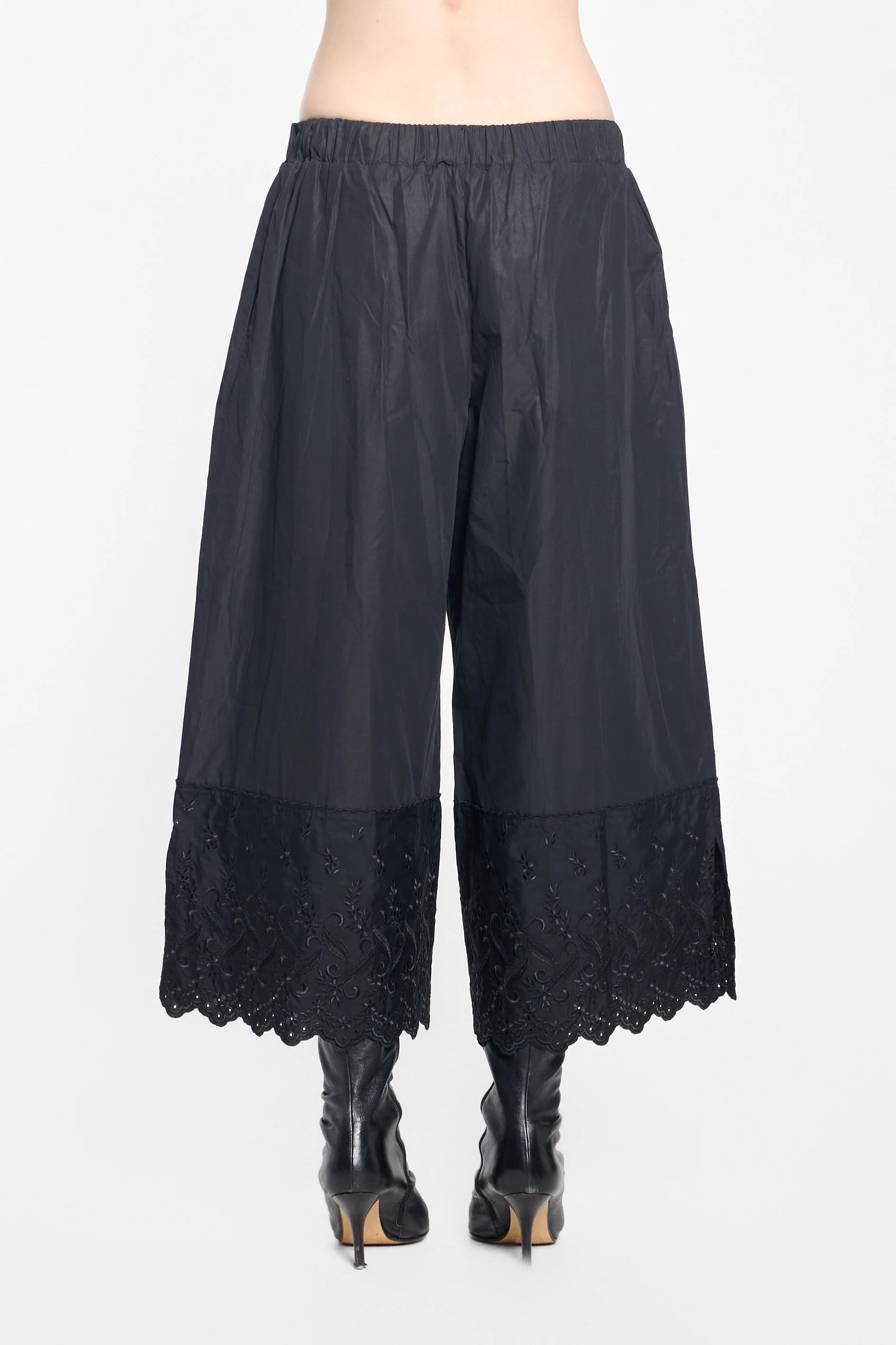 Back view of Simone Rocha wide-leg black trousers
