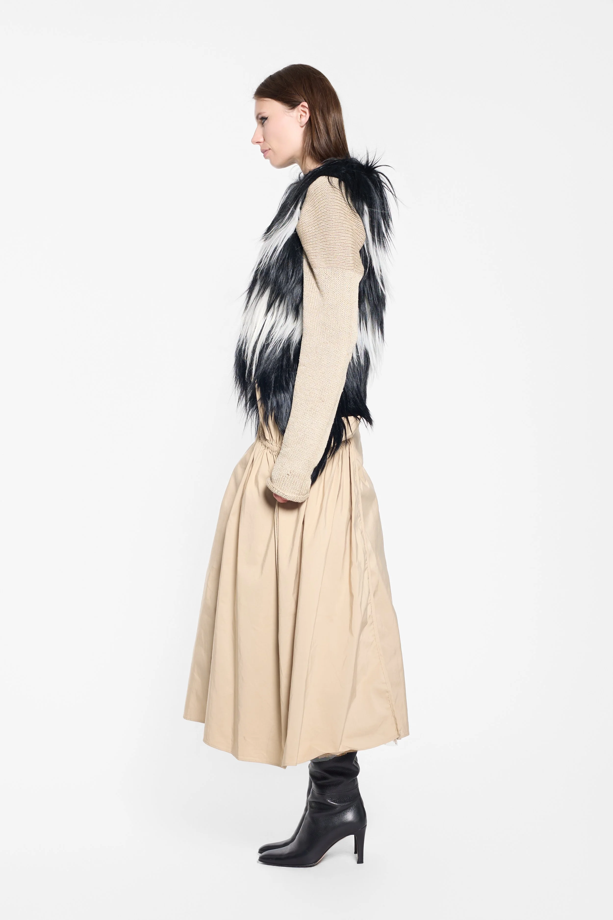 Side view of shaggy goat fur vest with longer fur strands