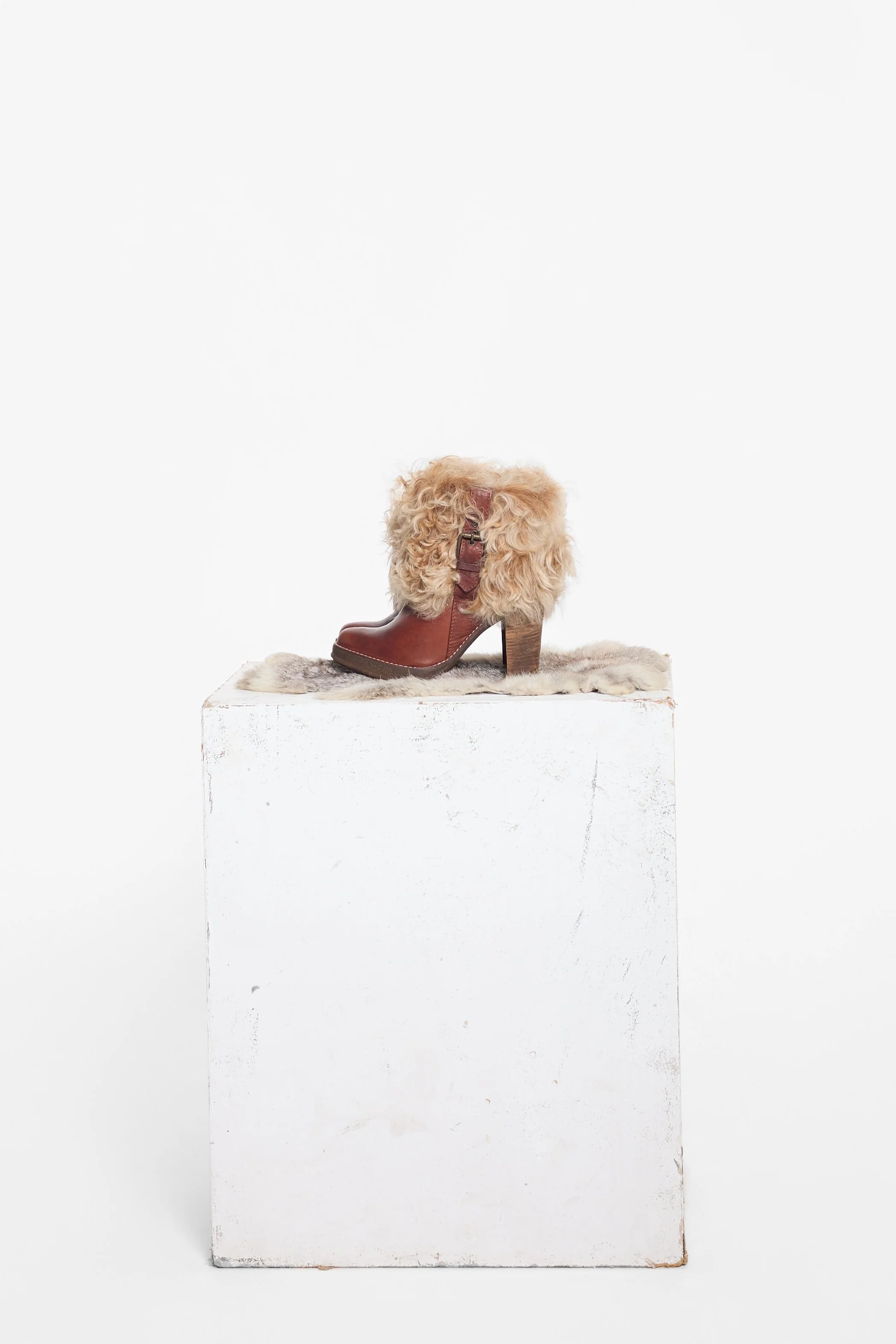 RAS brown leather boots with oversized Mongolian fur uppers