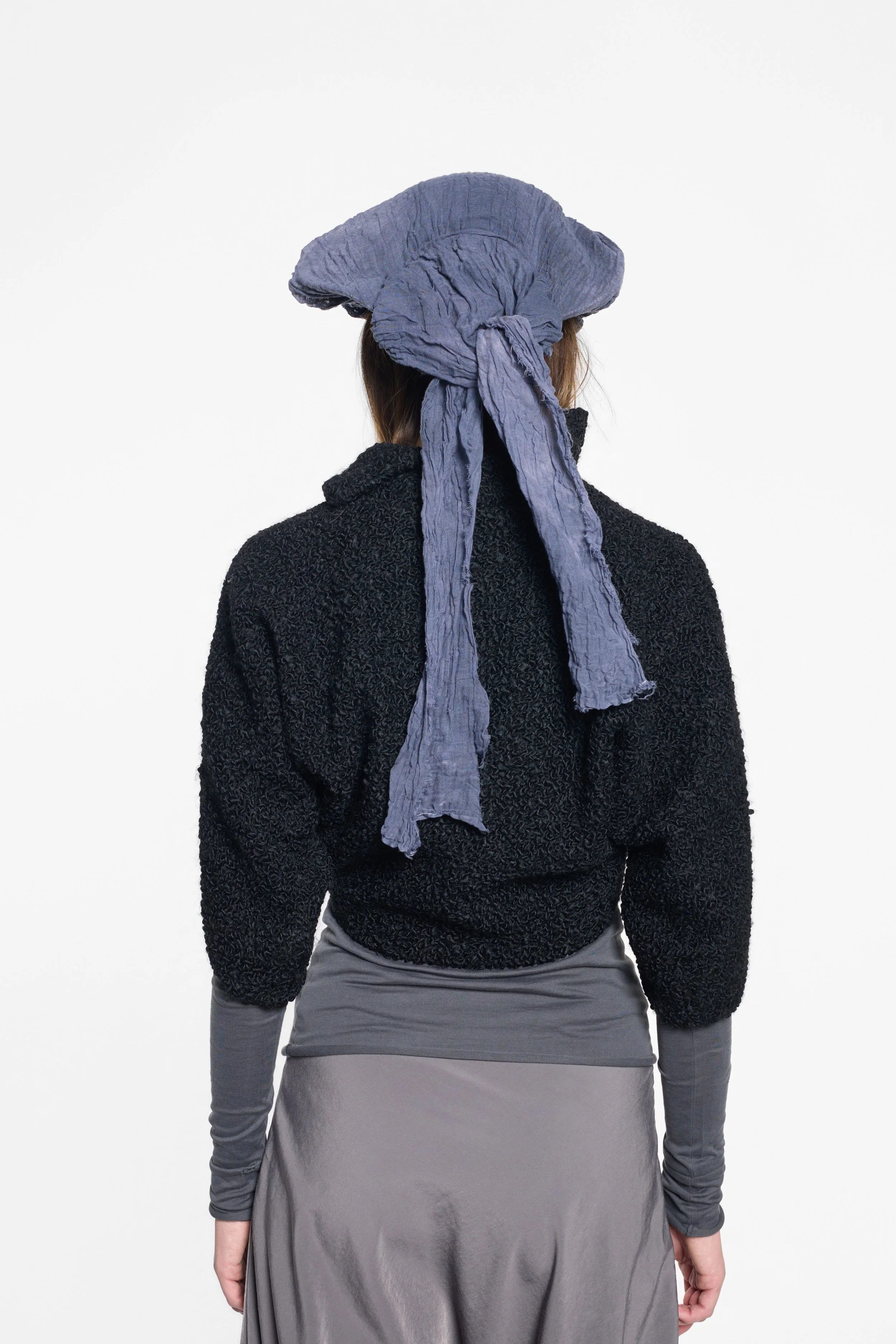 Back view of MVUDSLYDE tricorn hat with long trailing fabric ties