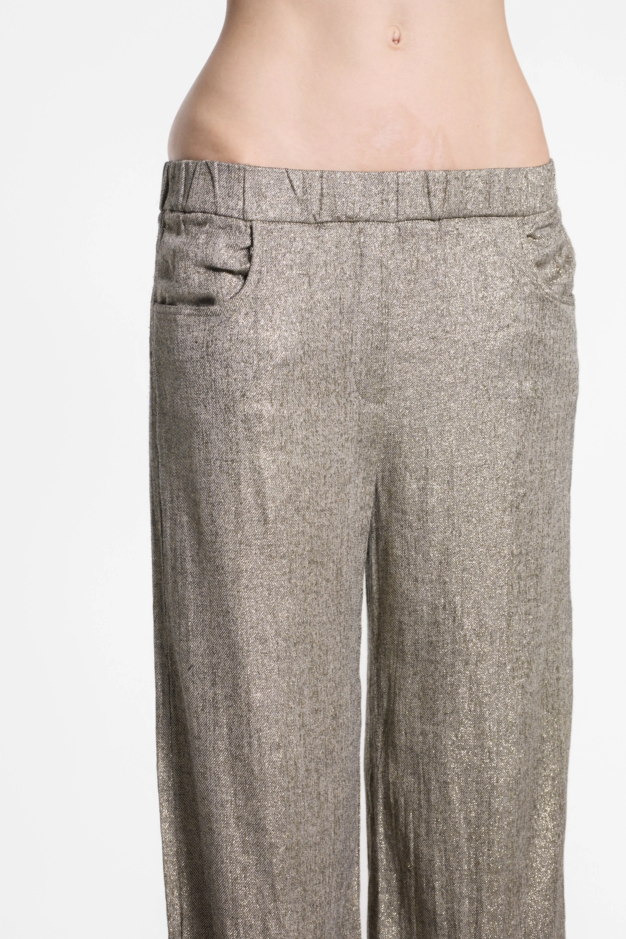 Detail of elasticated waistband and textured gold fabric on Diega wide-leg trousers