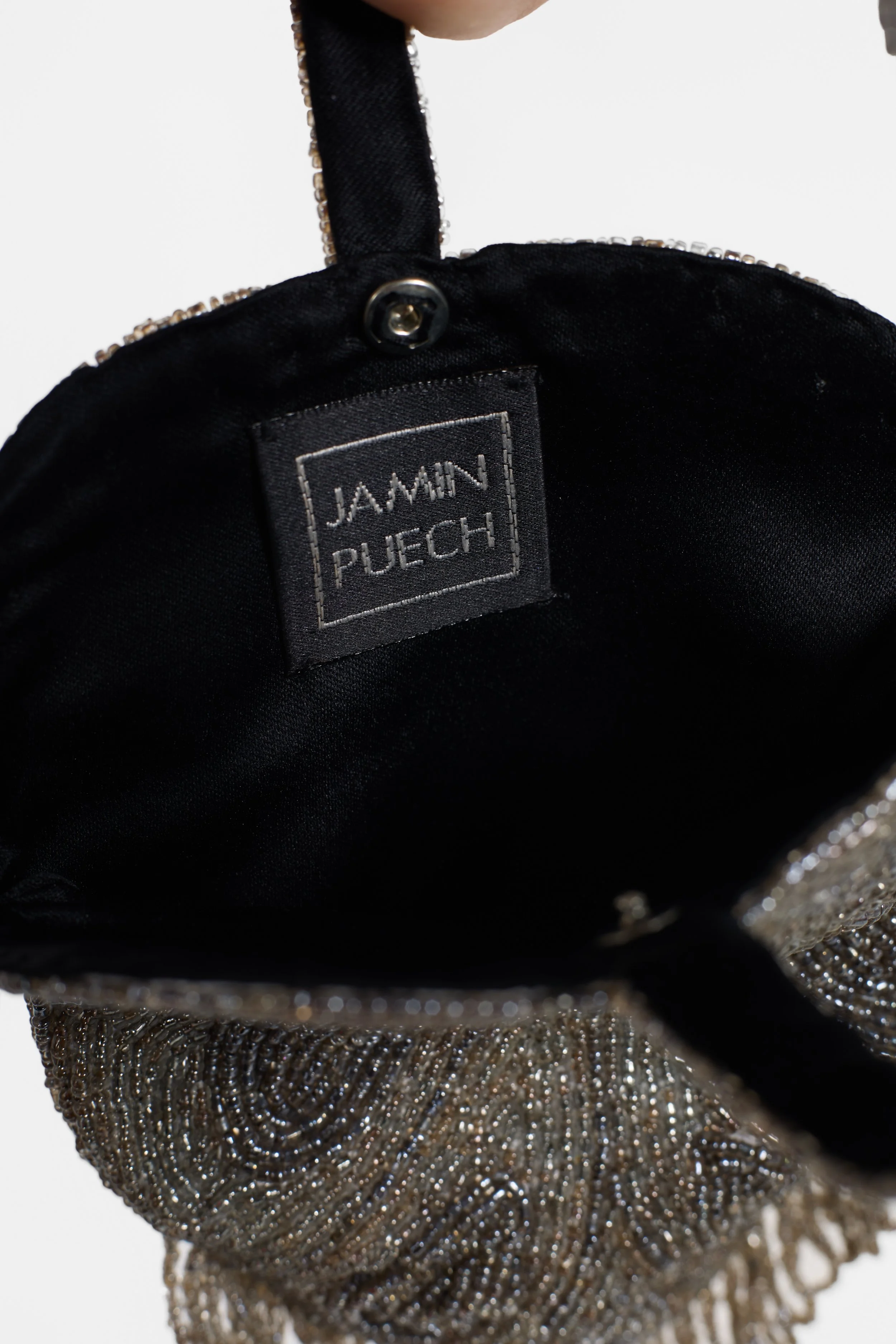 Close-up of Jamin Puech label and black-lined interior