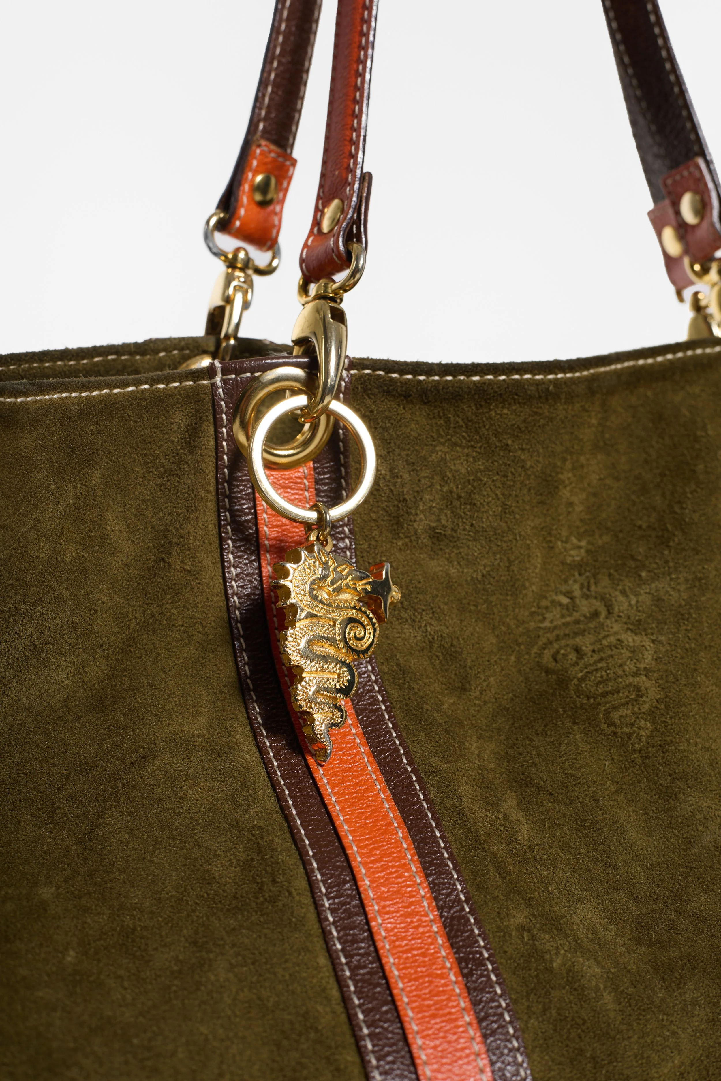 Khaki and orange suede tote bag with gold-tone charm hardware