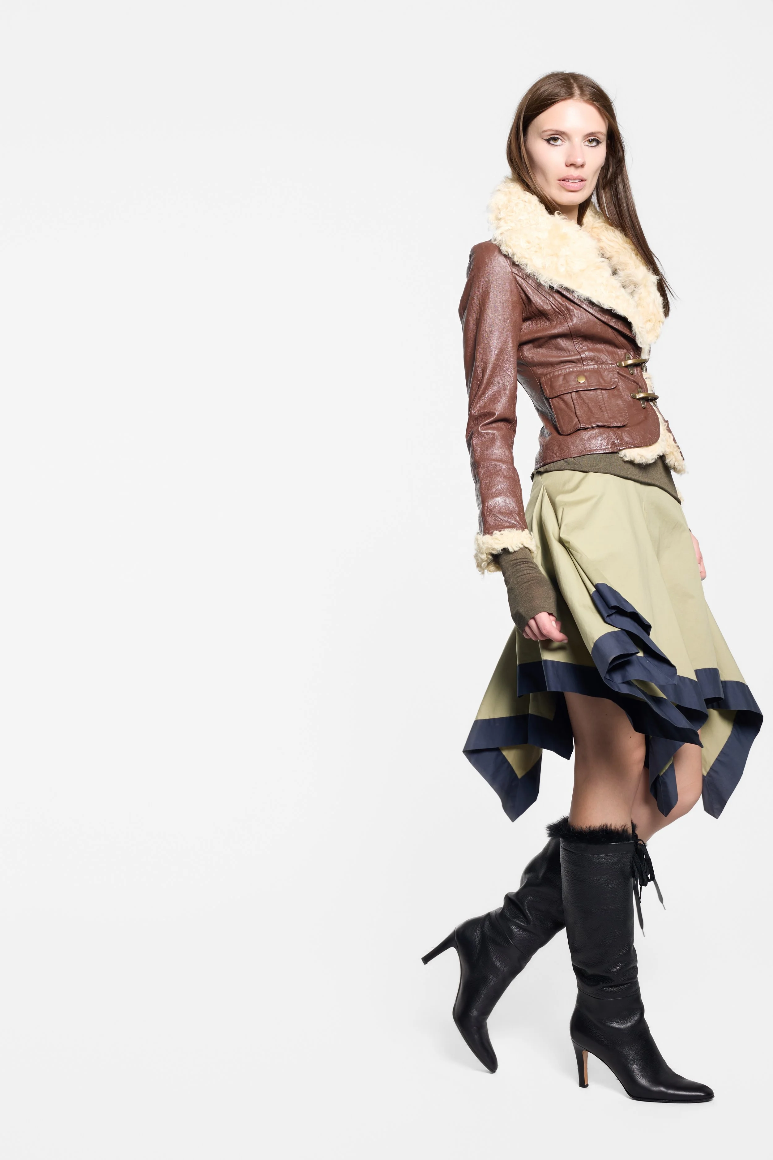 Vivienne Westwood olive asymmetric skirt styled on model, full-length editorial image