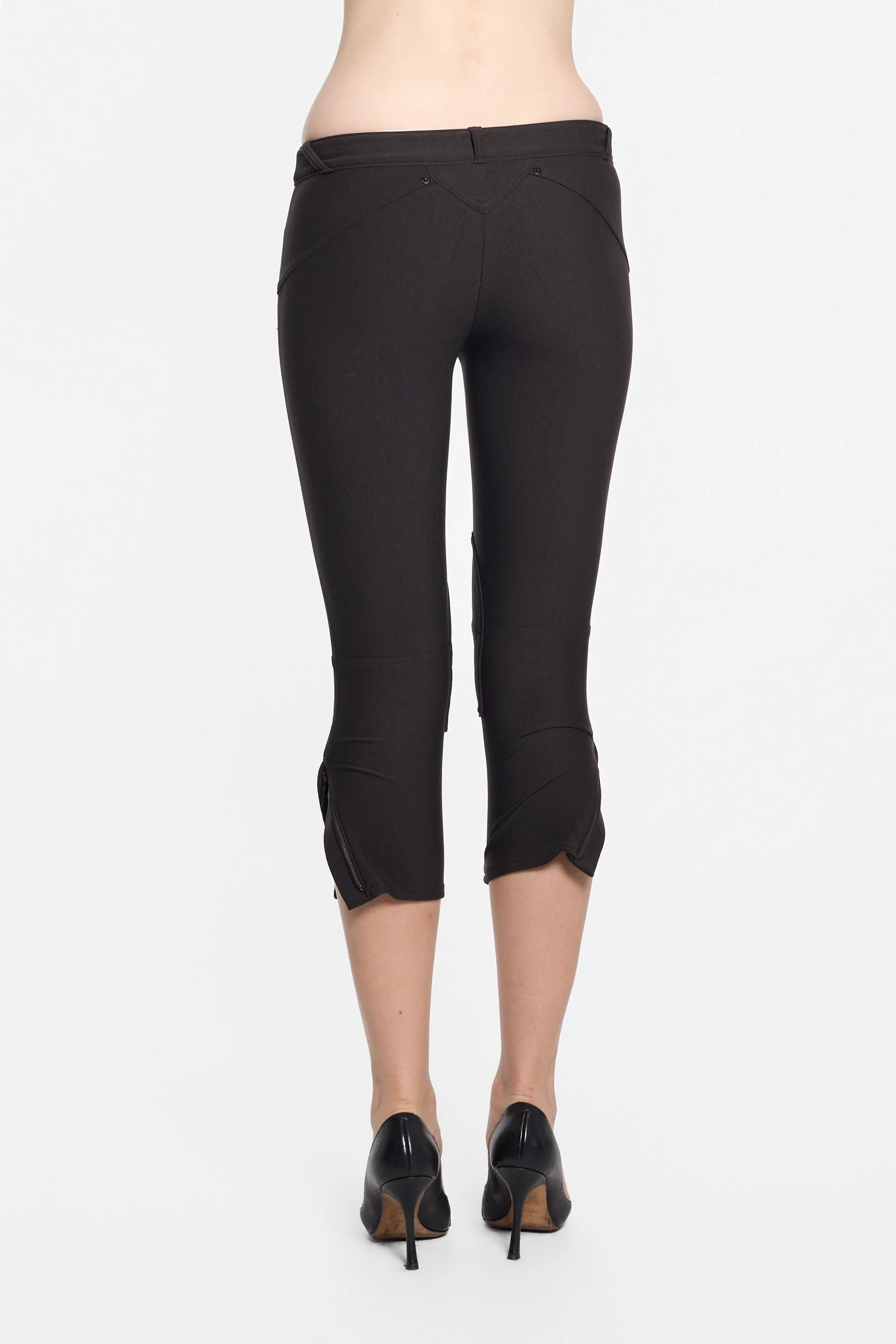 Back view of LUXXM black trousers showing curved yoke construction