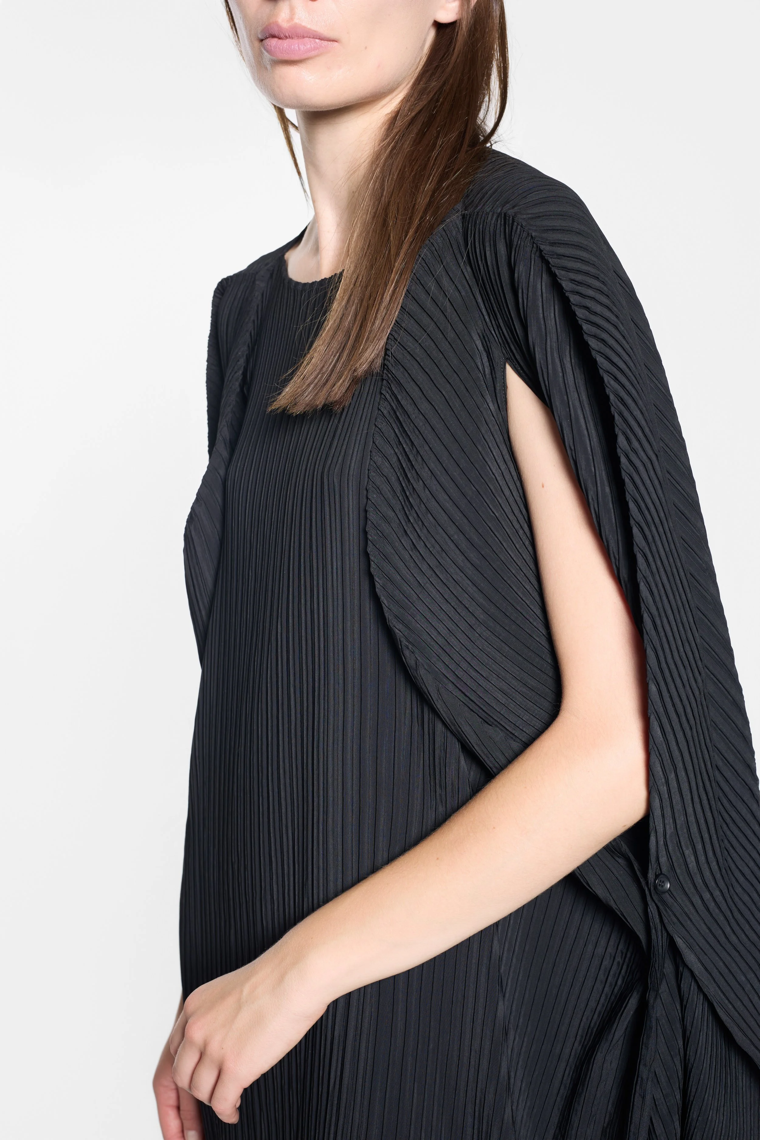 Split sleeve and fine pleating detail on the Issey Miyake dress