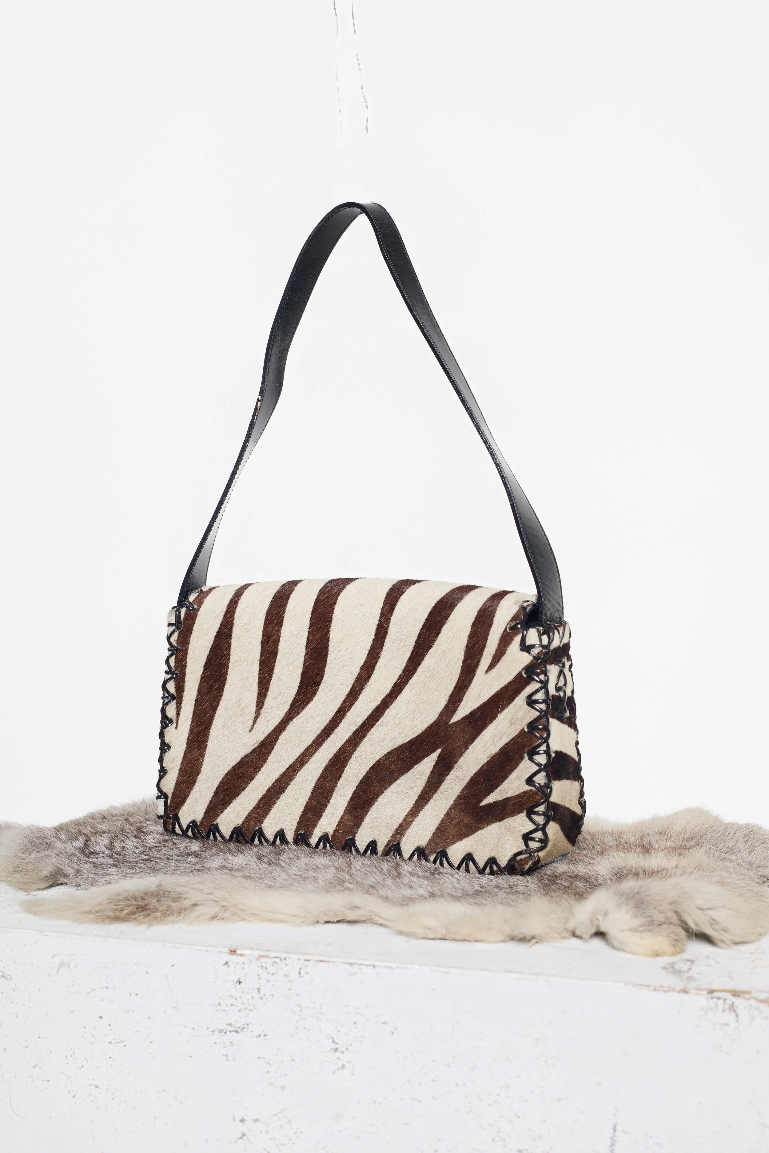 Another Back view of Russell & Bromley cowhide handbag with leather strap