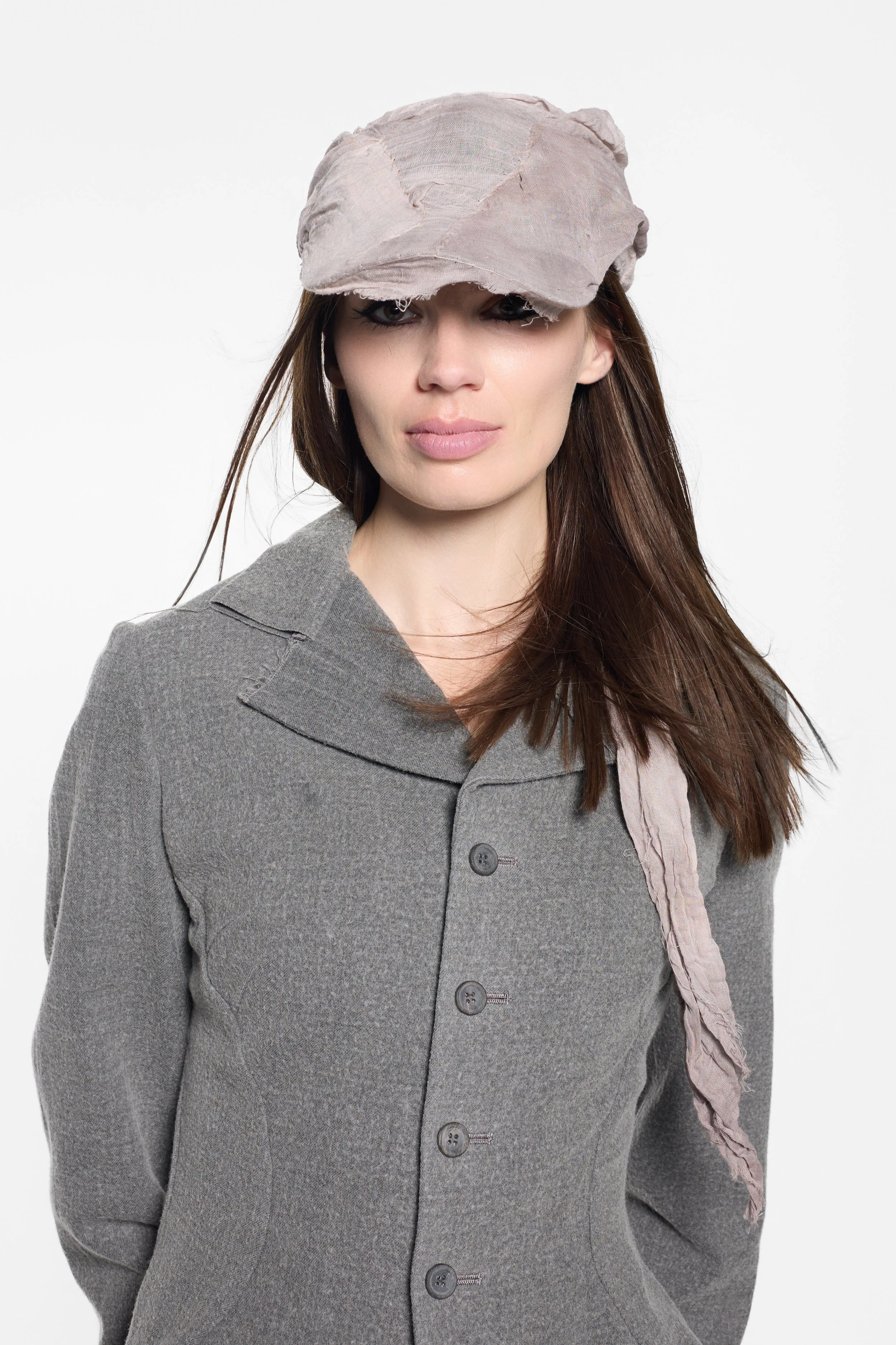 Front view of MVUDSLYDE multi-style draped wrap cap