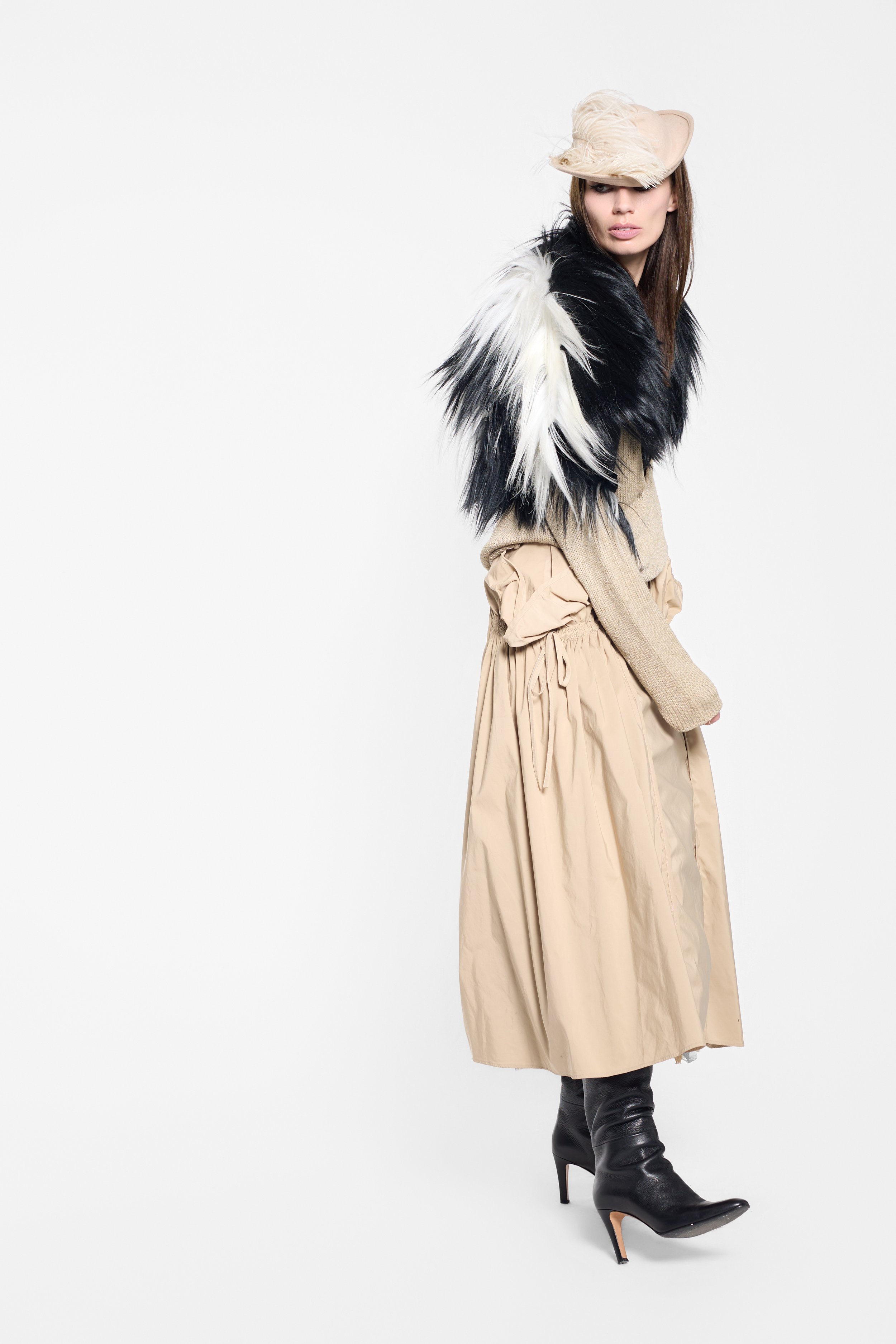 Long-haired fur gilet with fitted shape and flared side volume