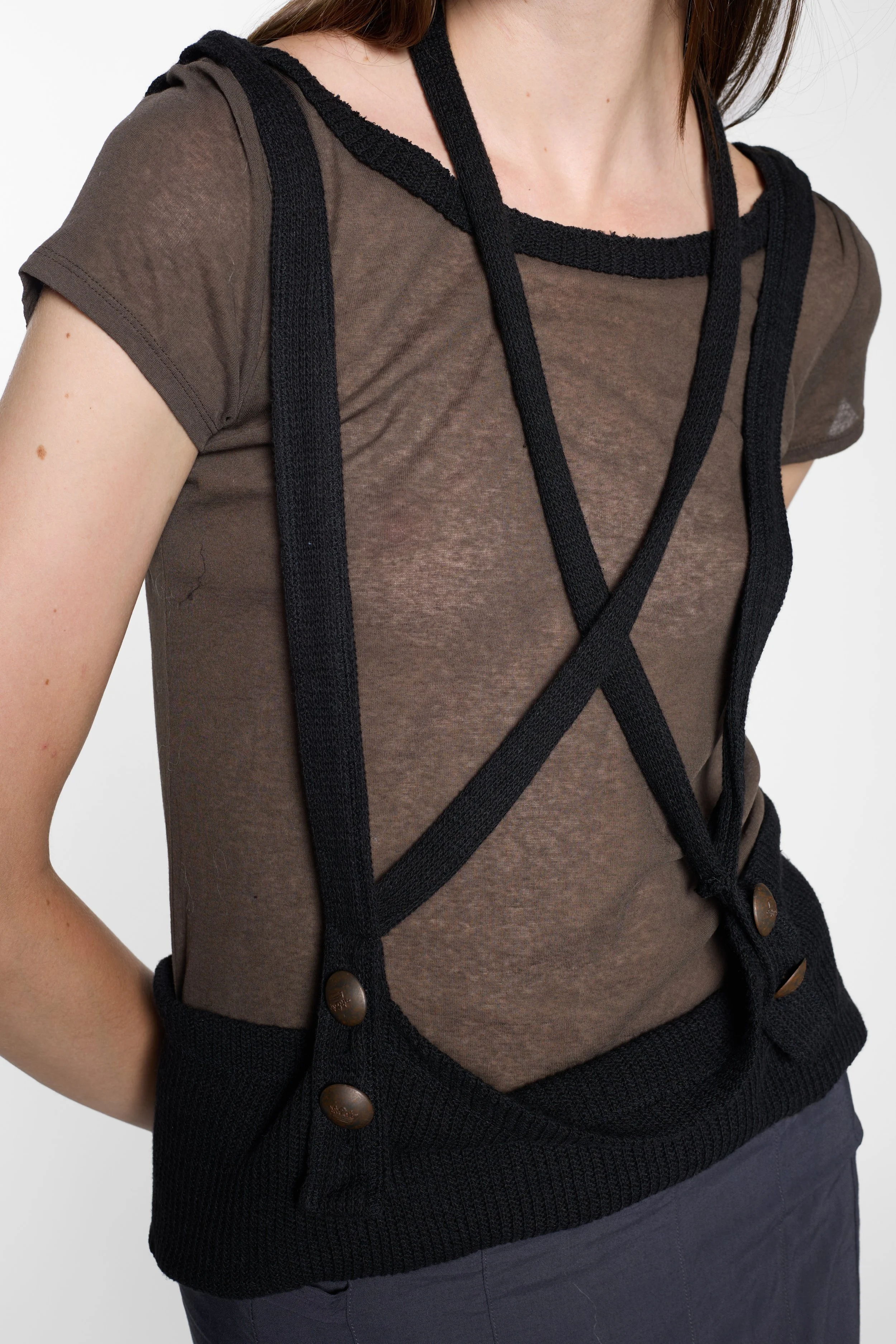 Close-up of LUXXM black buttoned strap and open-knit detailing