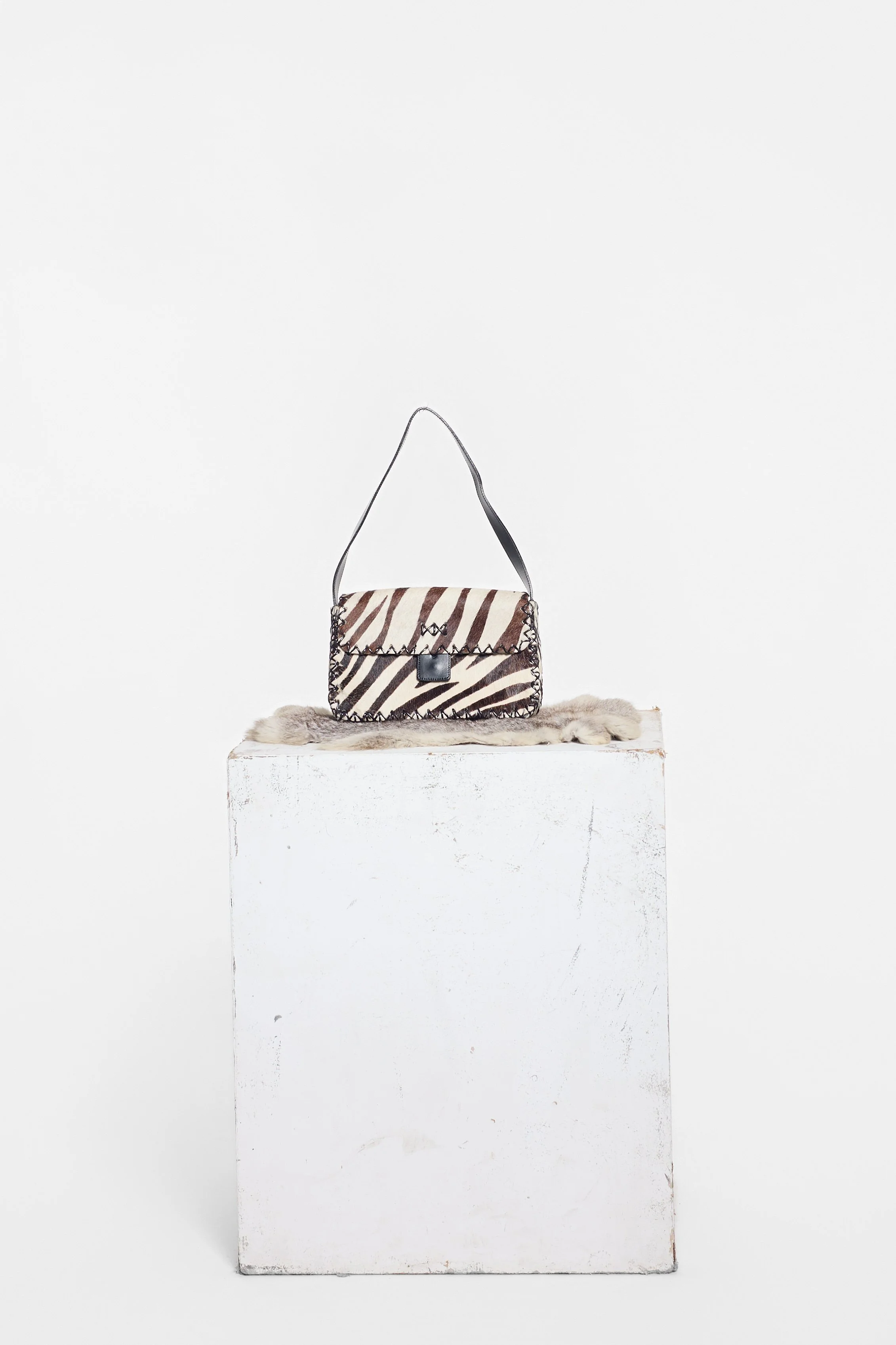 Russell & Bromley zebra-print cowhide shoulder bag with black leather strap