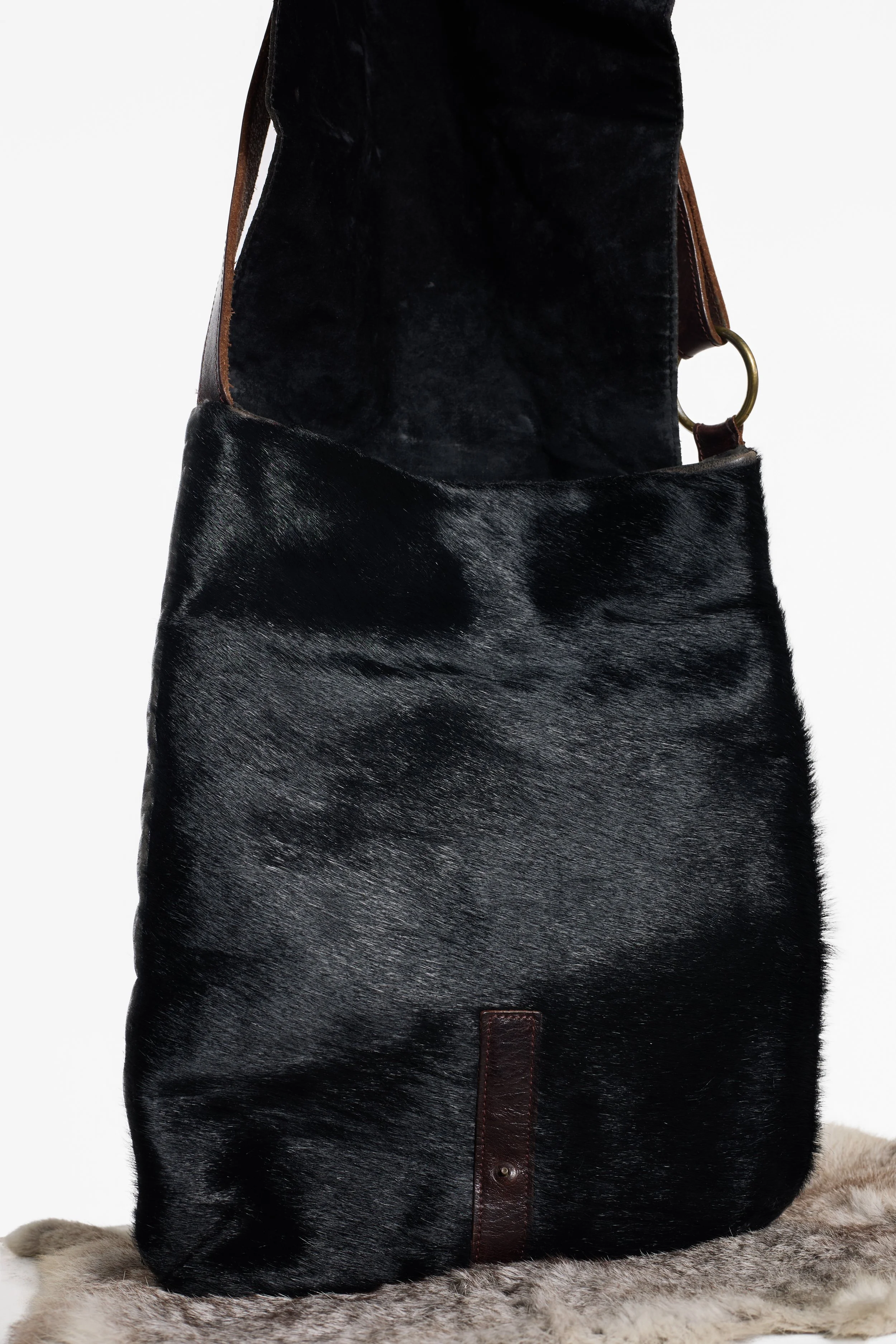 Black hair-on cowhide bag with distressed charcoal leather flap