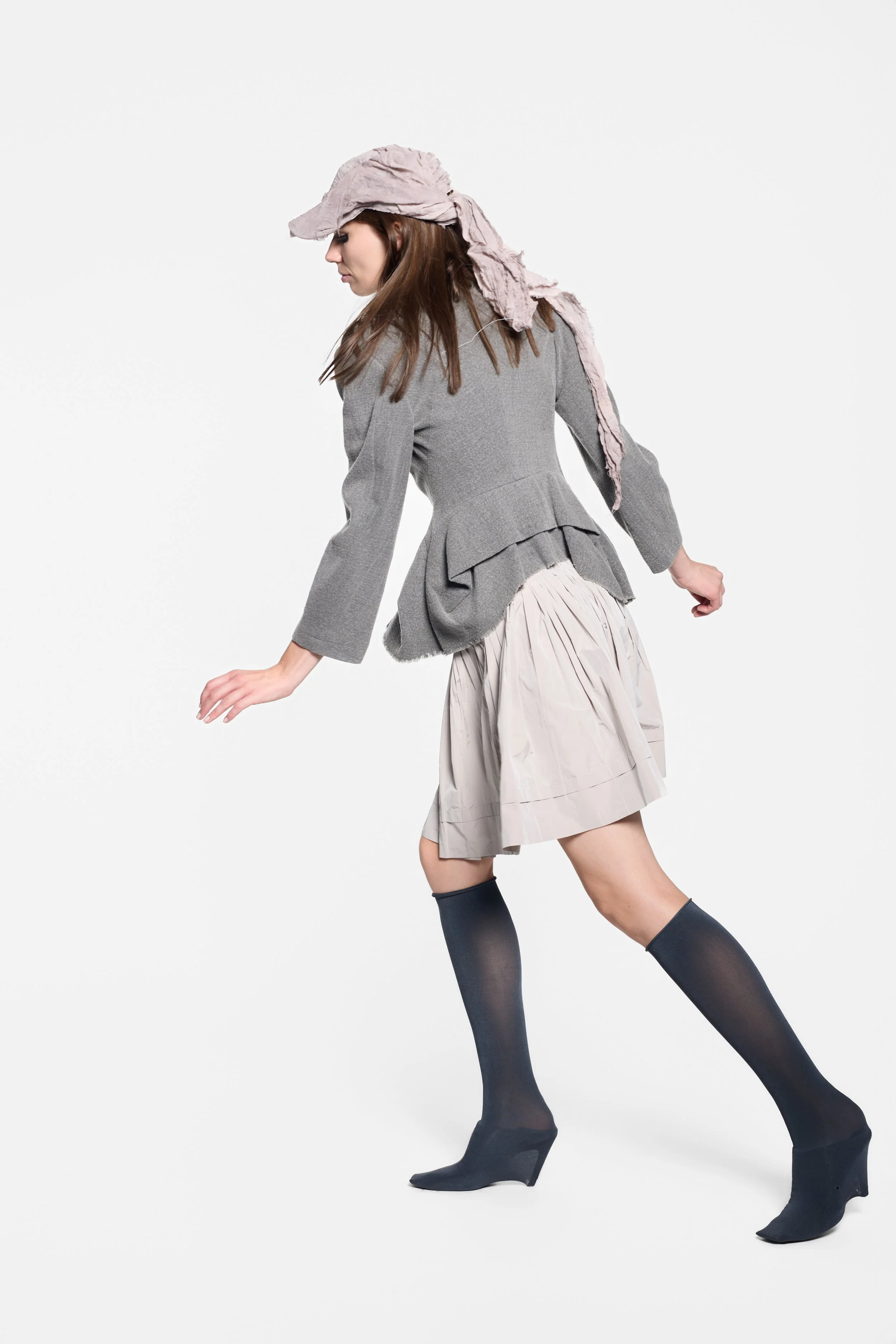 Model wearing MVUDSLYDE hand-dyed washed mauve draped cap