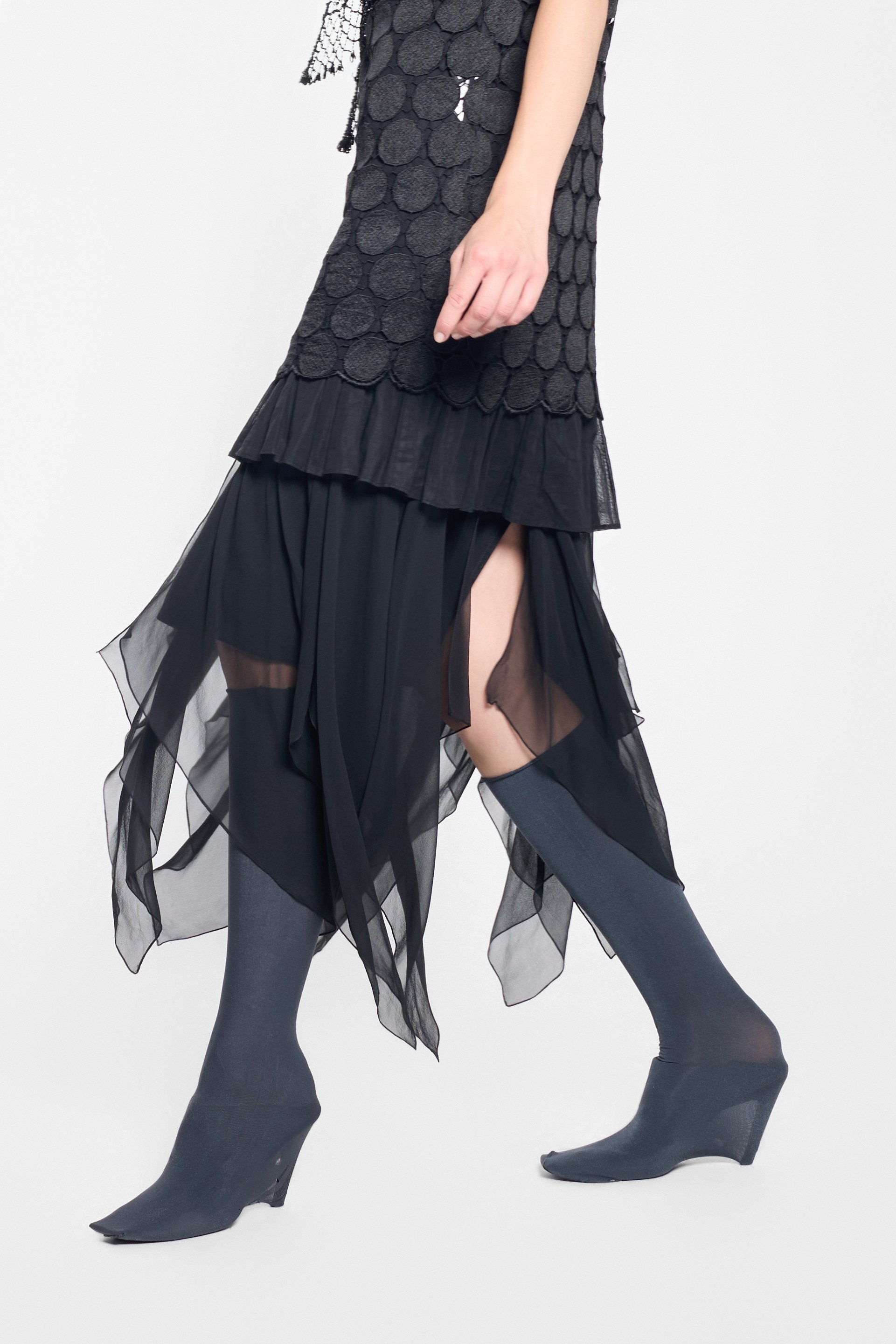 Detail of flowing silk skirt and handkerchief hem on vintage Oleg Cassini dress