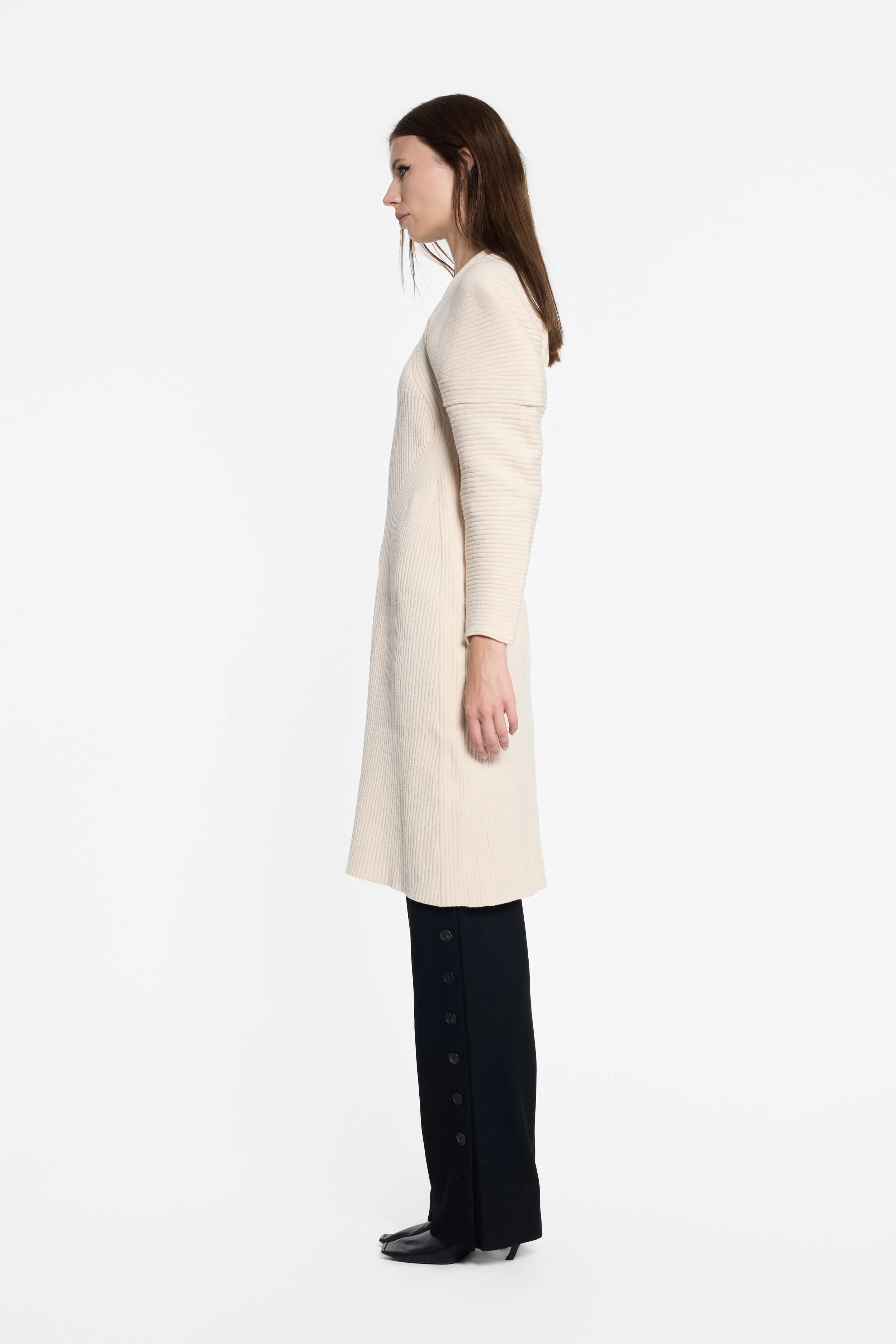 Side view of IRENE ivory knit dress with sculpted shoulder shape