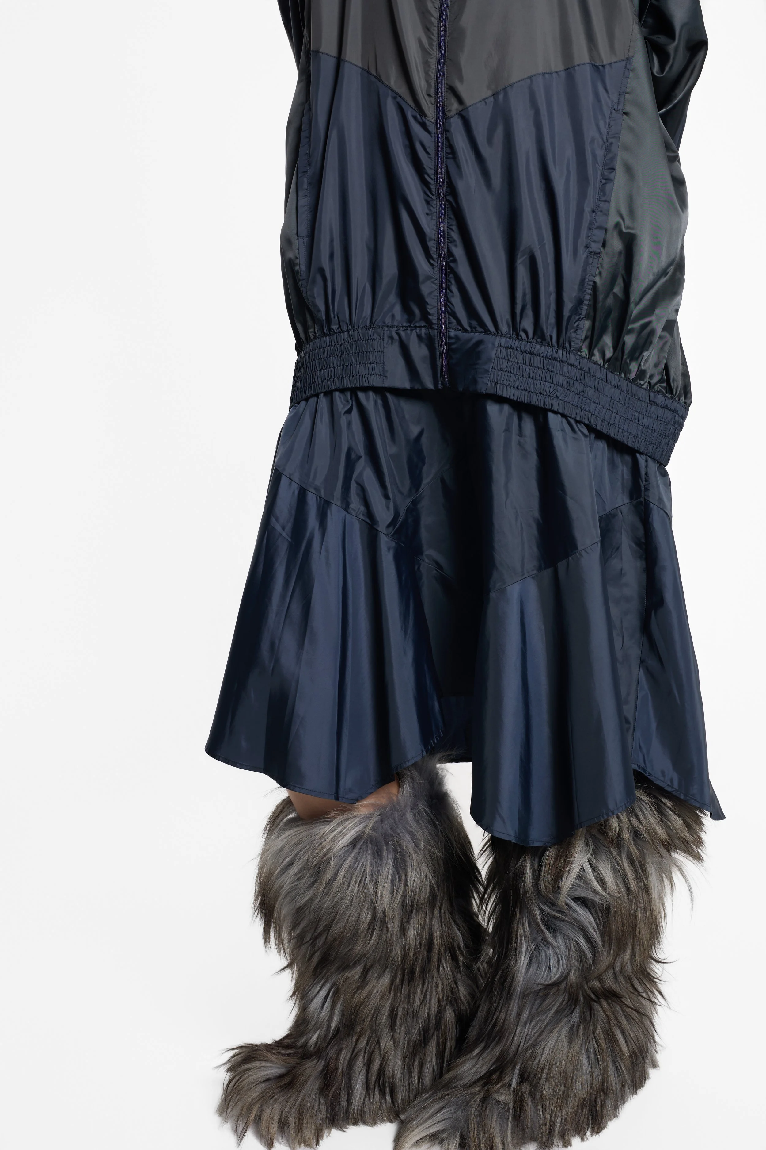 Close-up of detachable zip waist and technical nylon construction