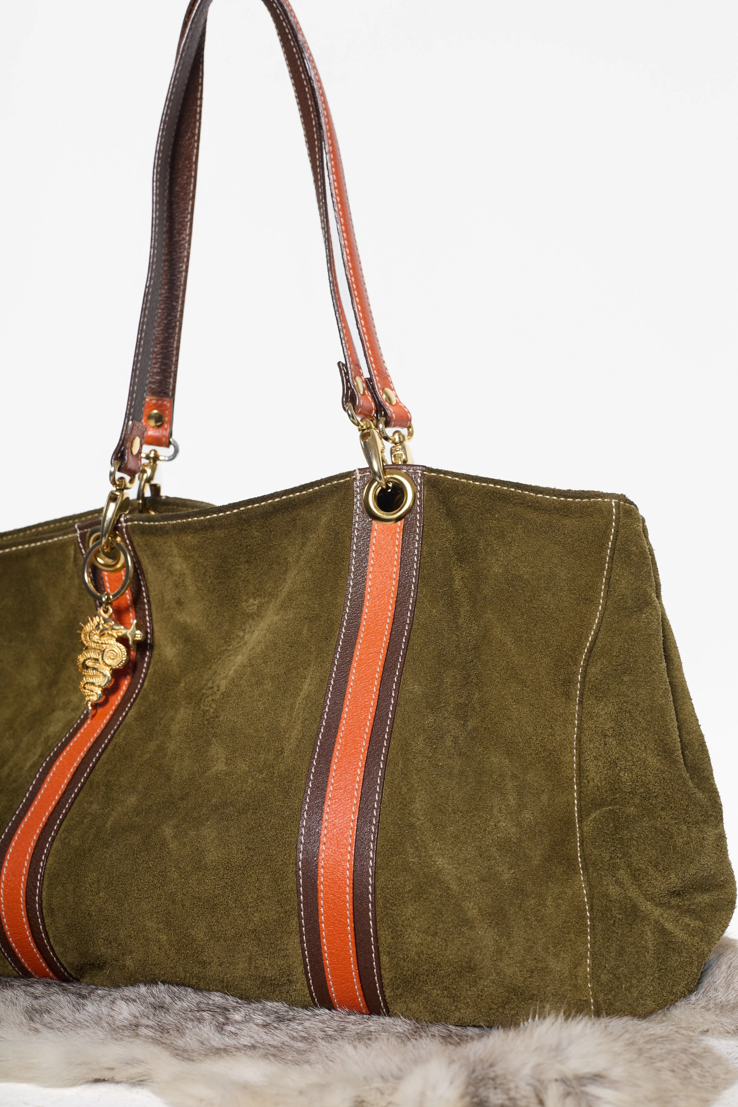 Khaki and orange suede tote bag with gold-tone charm hardware