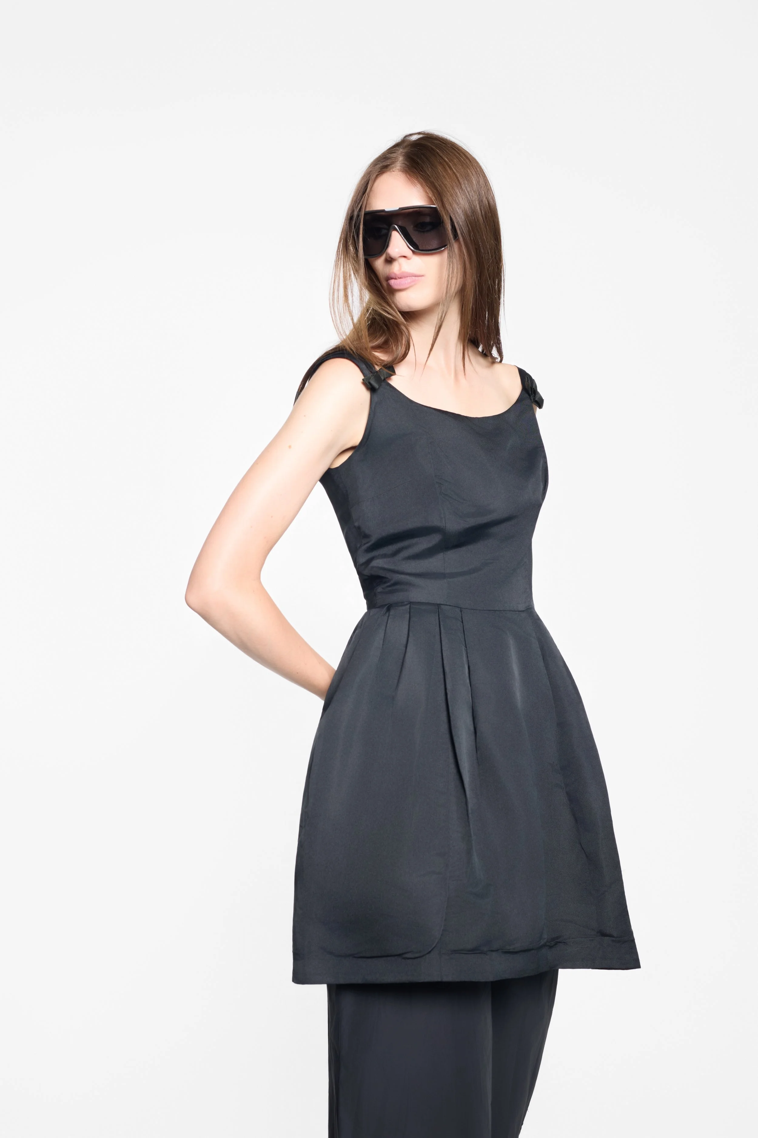 Model wearing a vintage Harvey Berin by Karen Stark black dress
