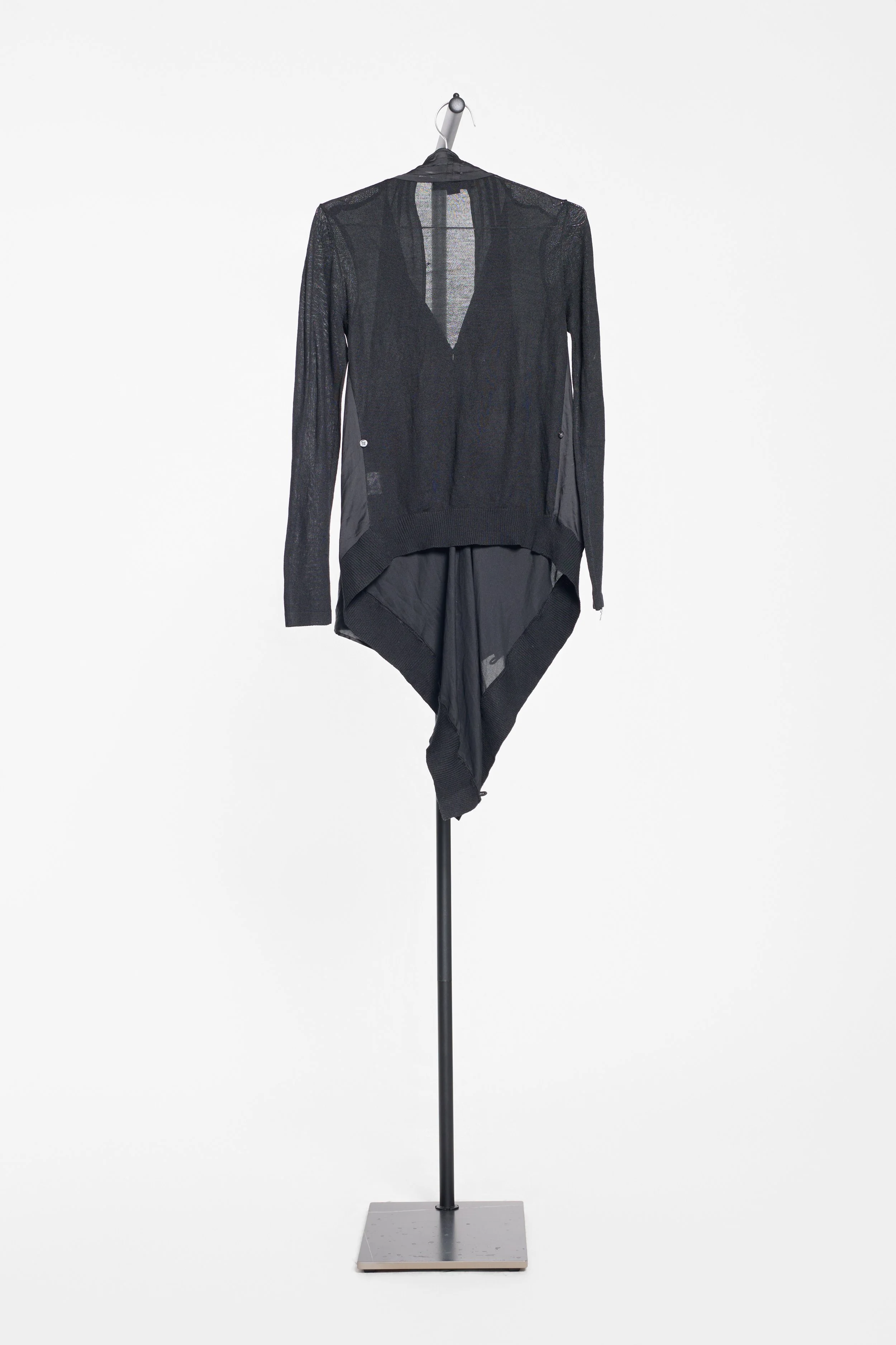 Back view of Alexander Wang black cardigan showing fluid asymmetric drape
