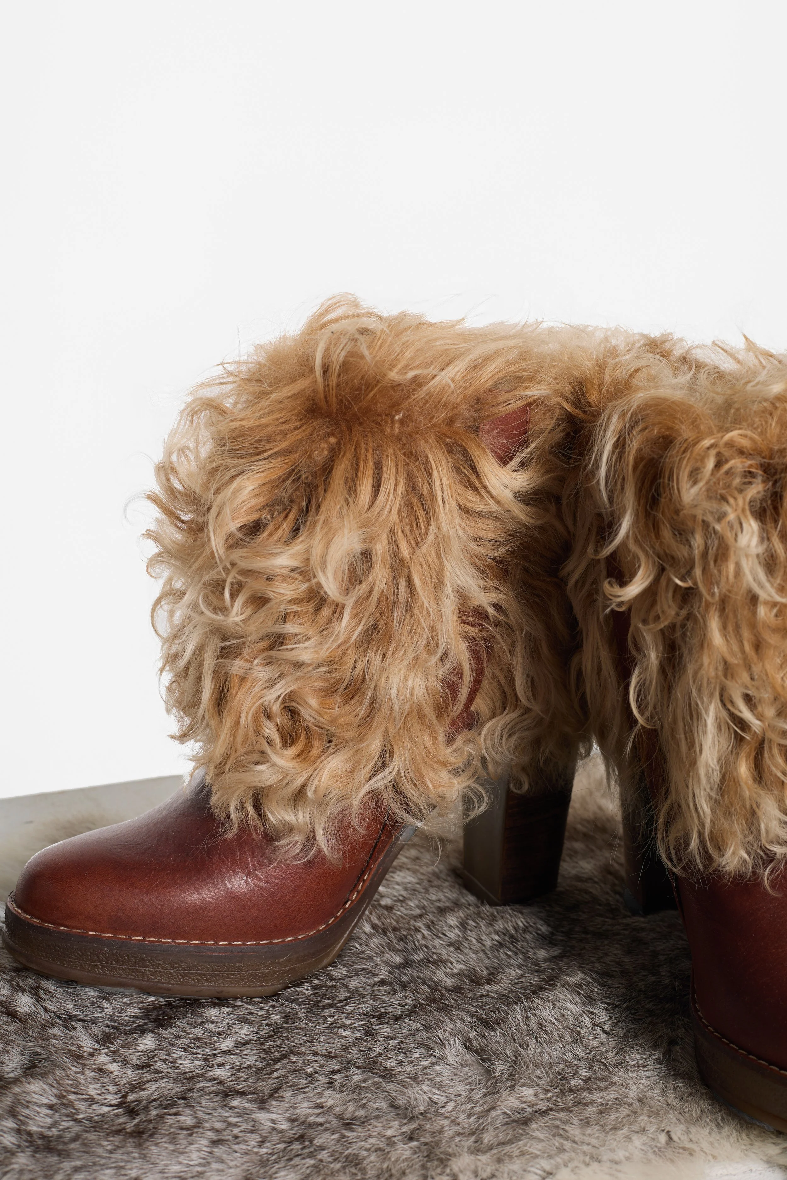 Detail of brown leather upper and chunky heel on Spanish RAS boots