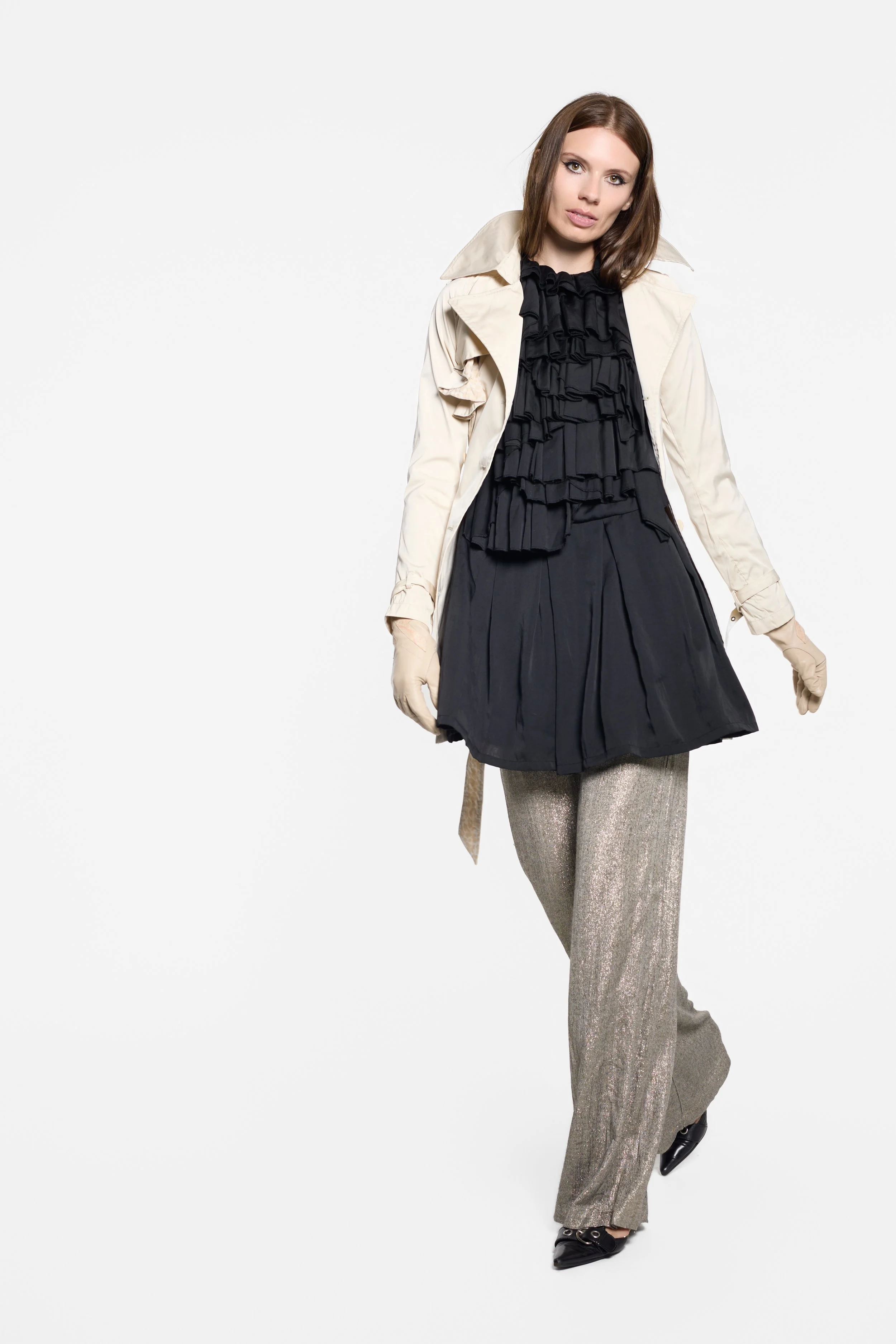 Model wearing Diega antique gold metallic trousers