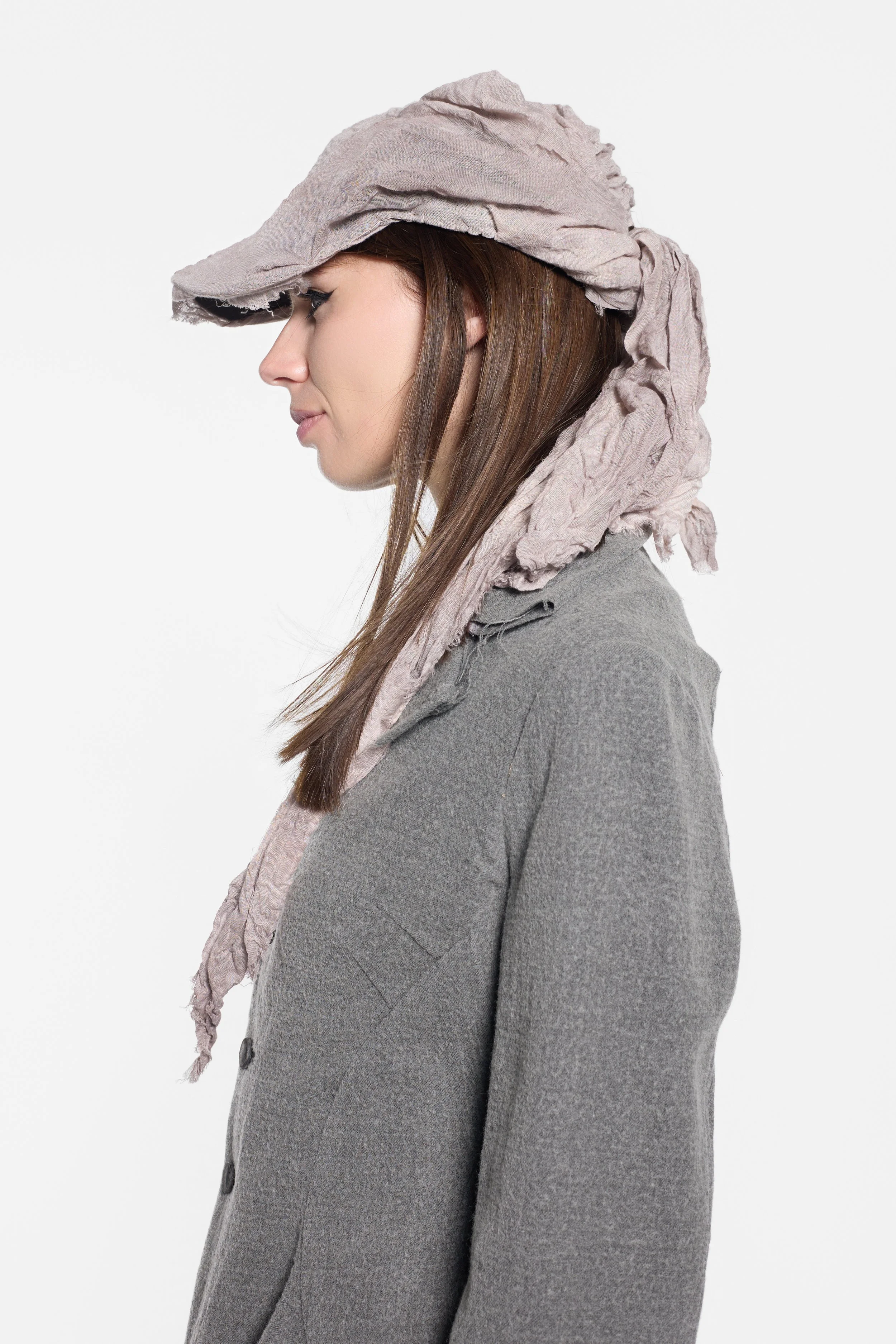 Side view of MVUDSLYDE hand-dyed muslin hat with layered fabric