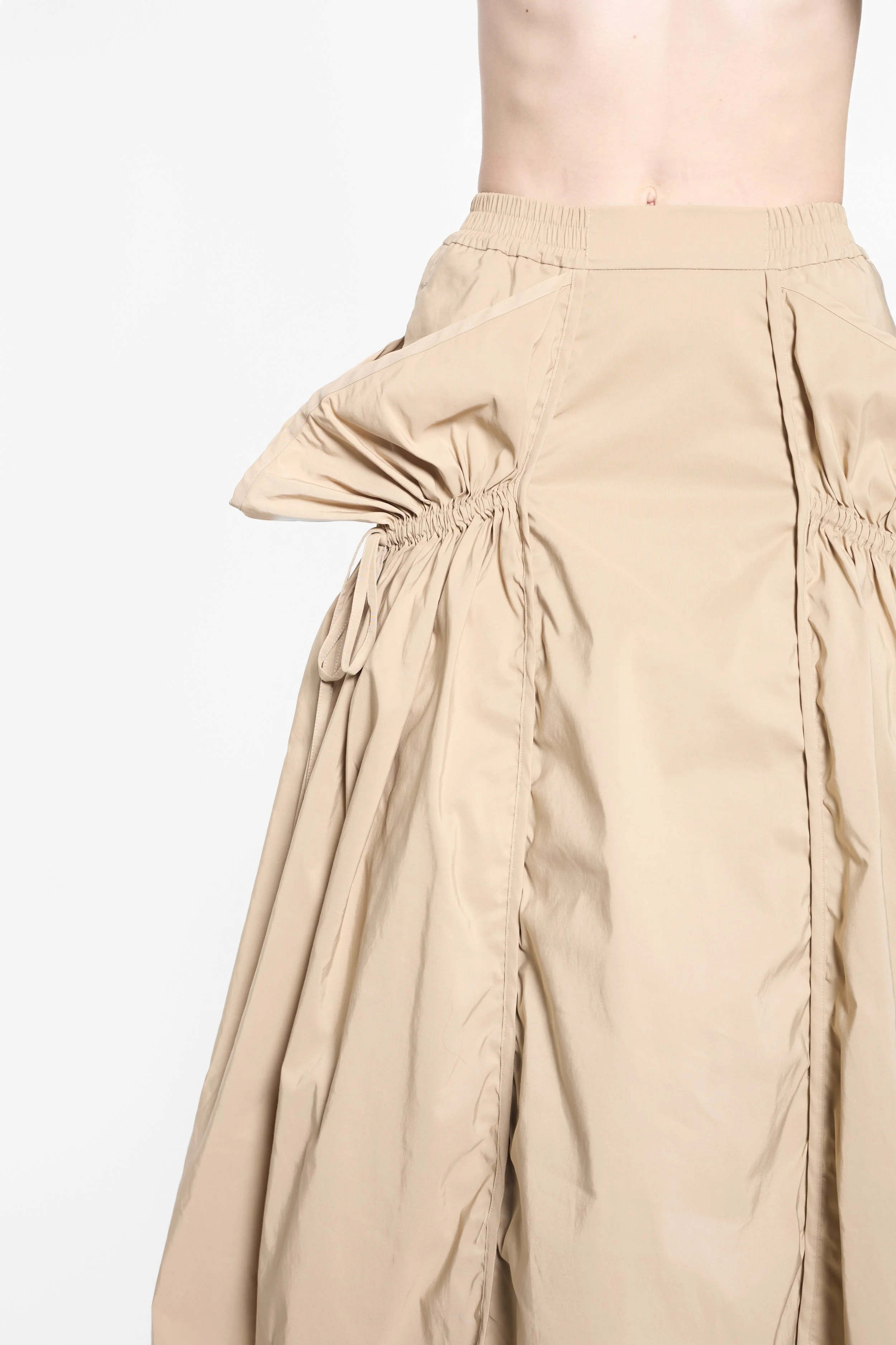 Detail of elasticated waistband and vertical panel seams on UN3D midi skirt