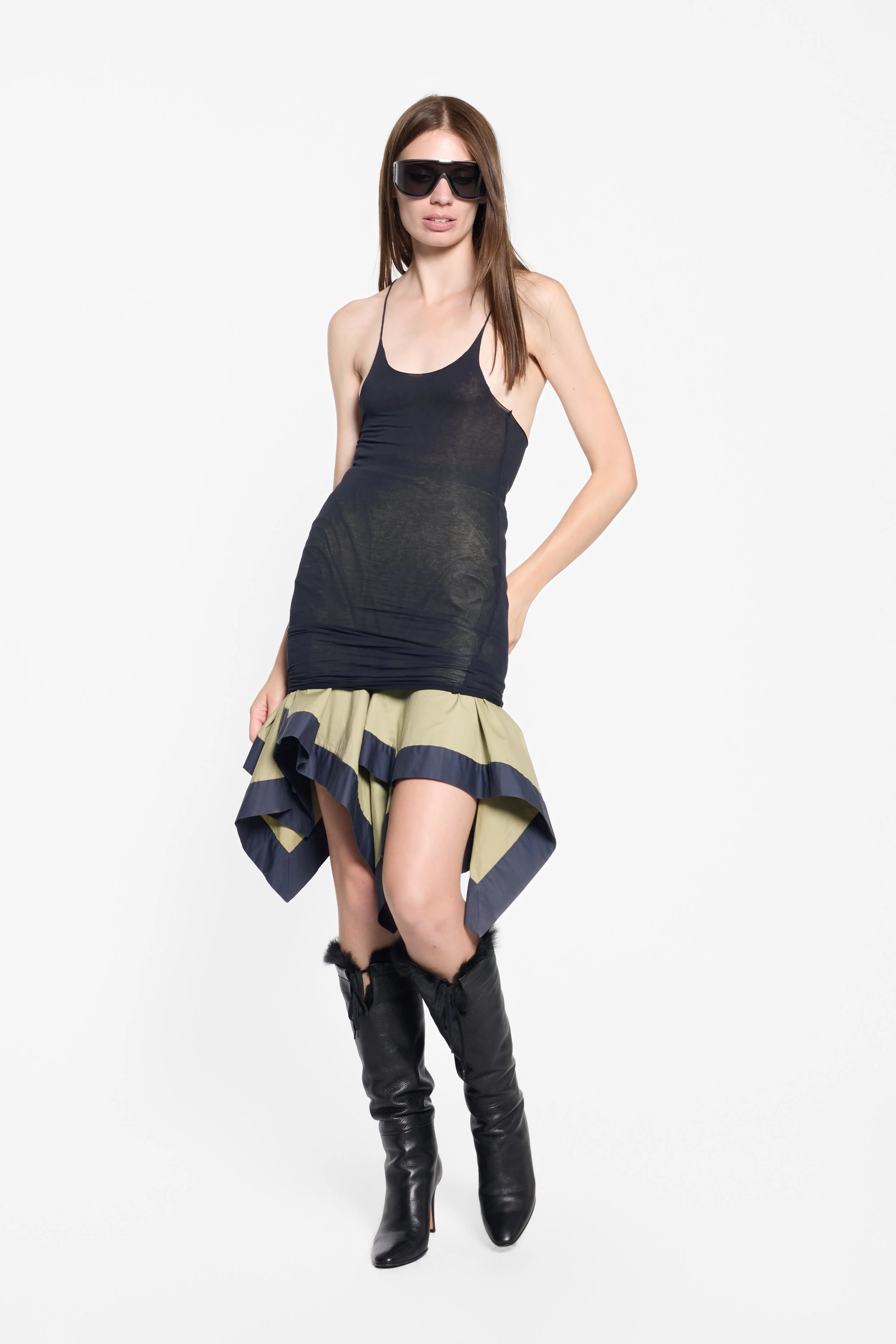 Janus black sheer racerback vest styled on model, full-length editorial image