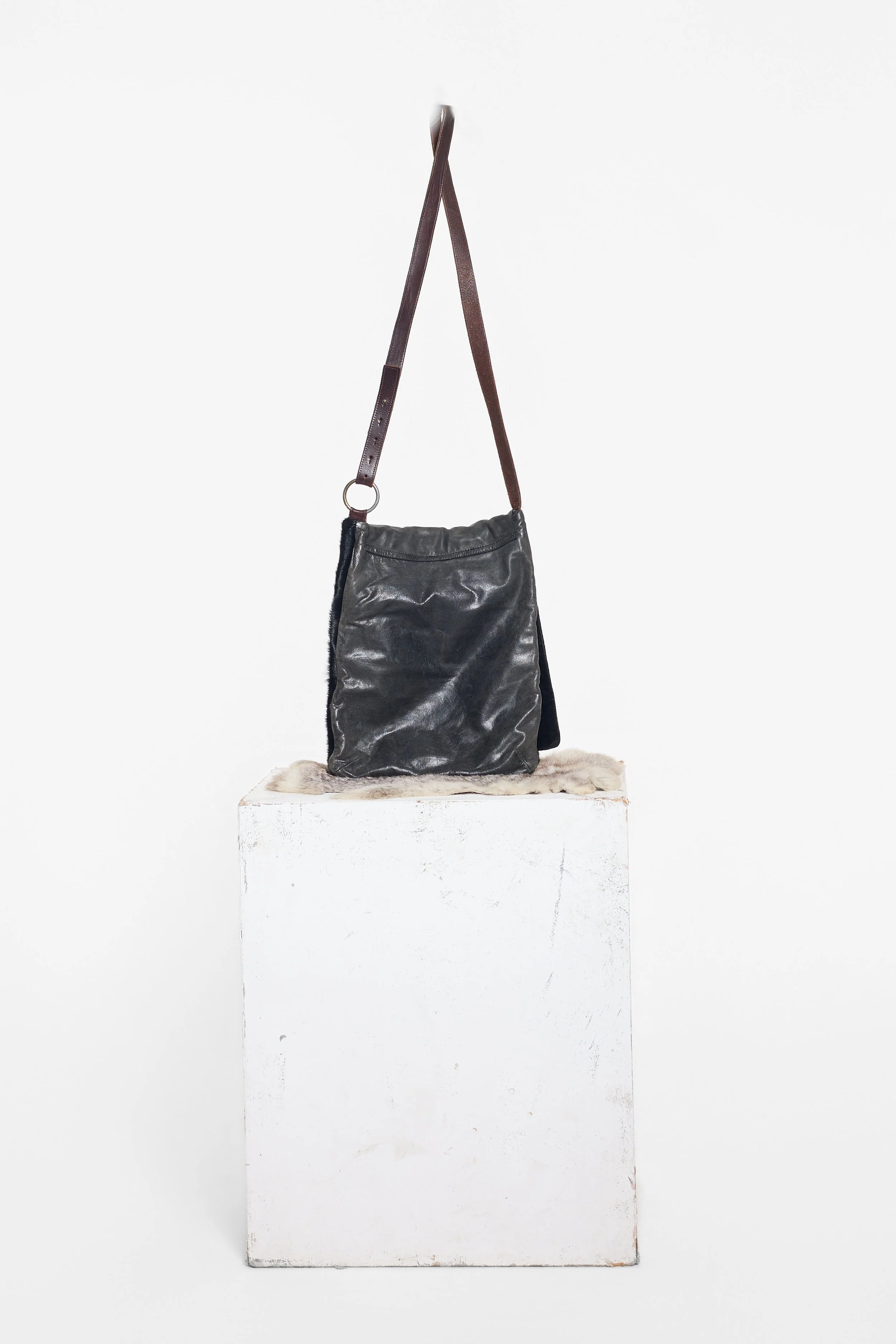 Back view of AllSaints ponyhair bag with aged leather construction