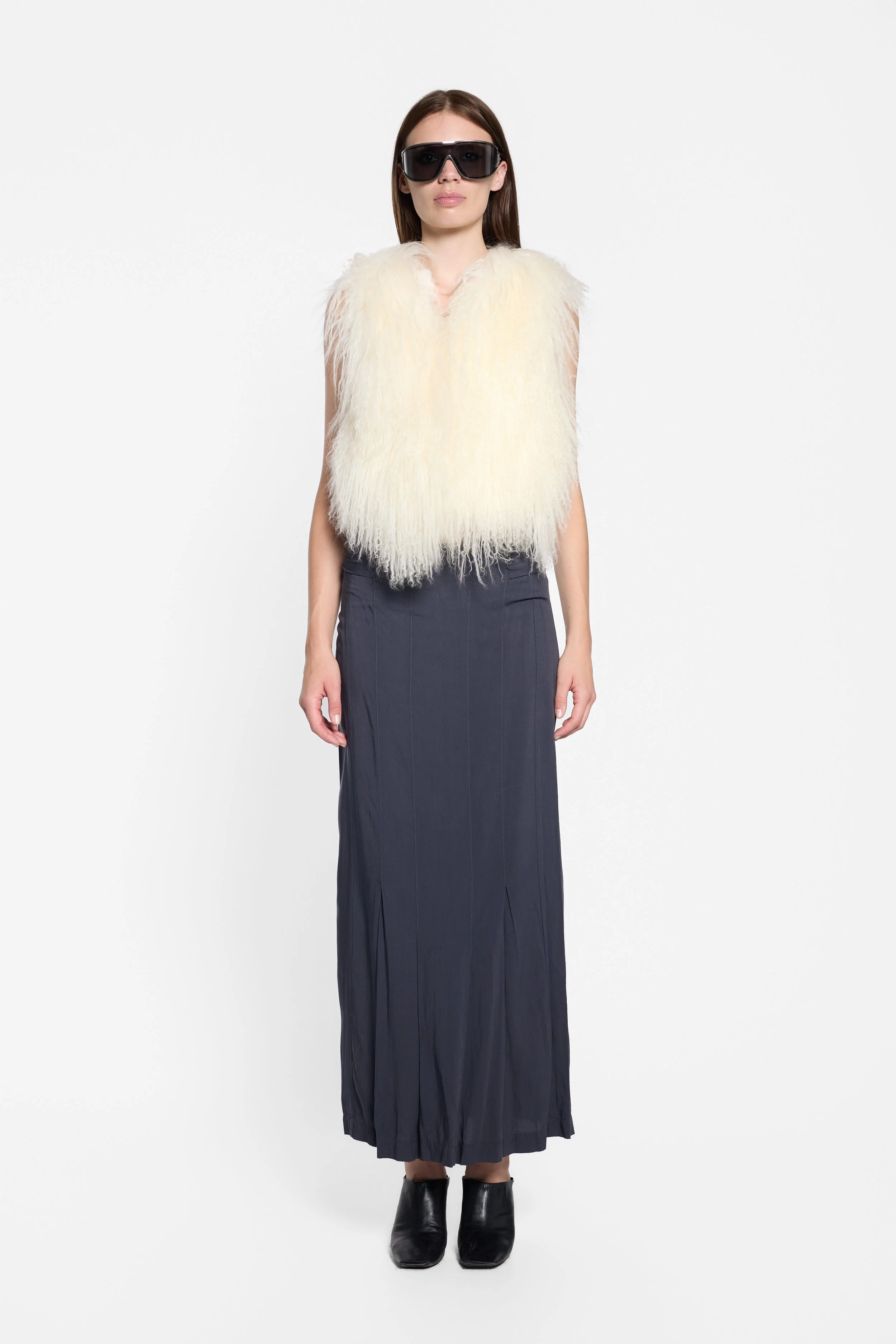 Front view of ivory Mongolian fur gilet with hook fastening