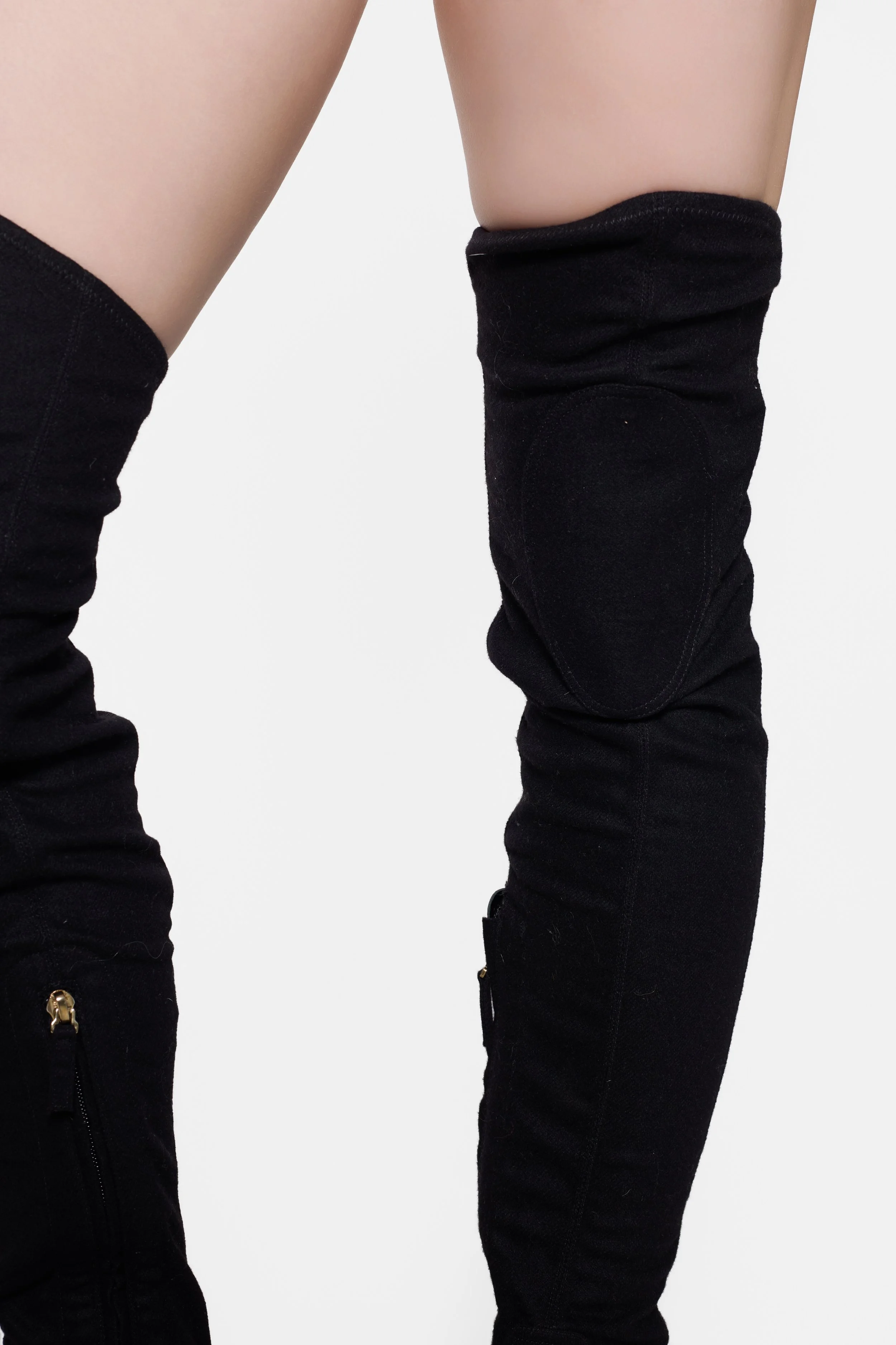 Side view of Valentino black suede boots with gold kitten heel
