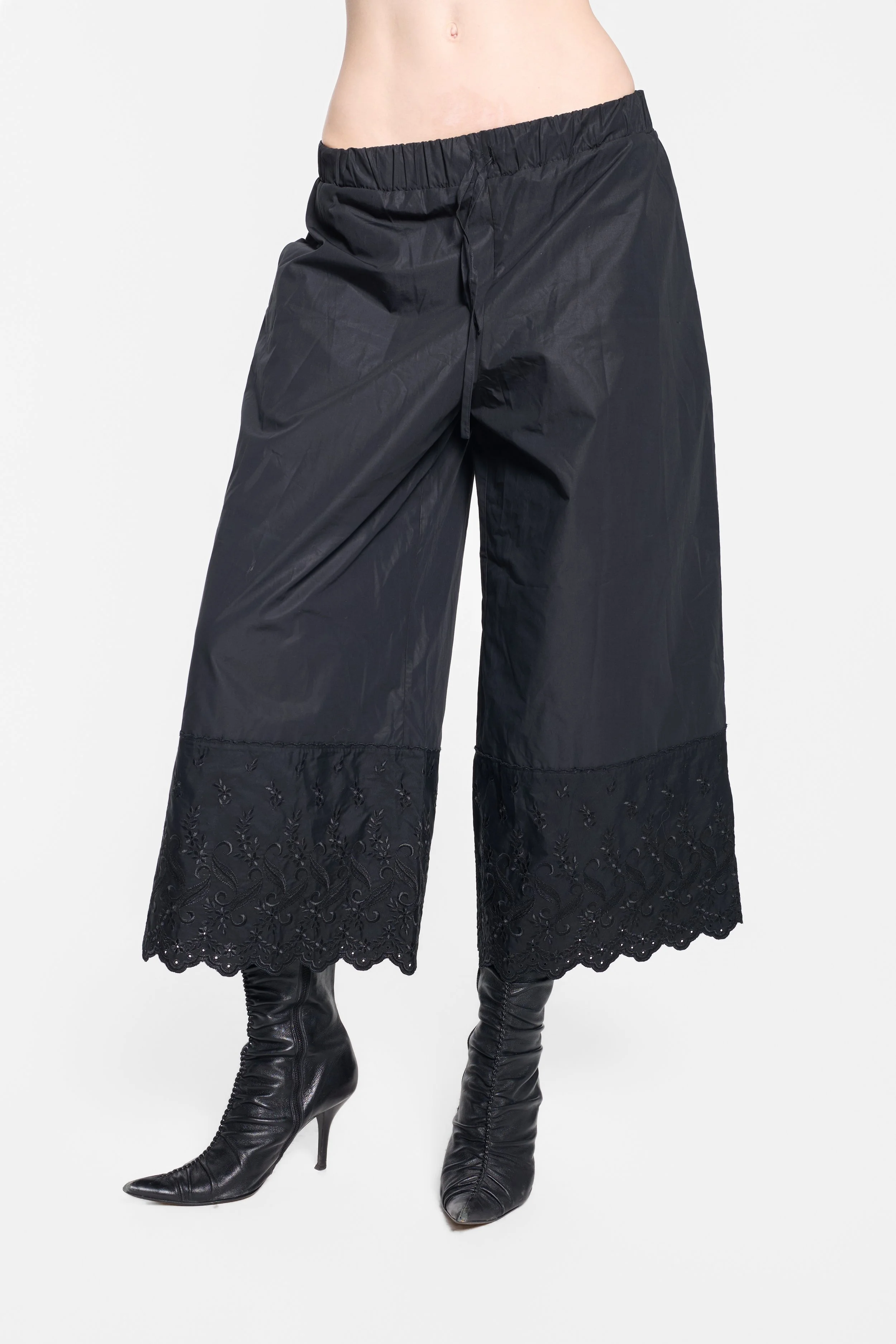 Detail of scalloped cutwork and paisley embroidery on Simone Rocha trousers