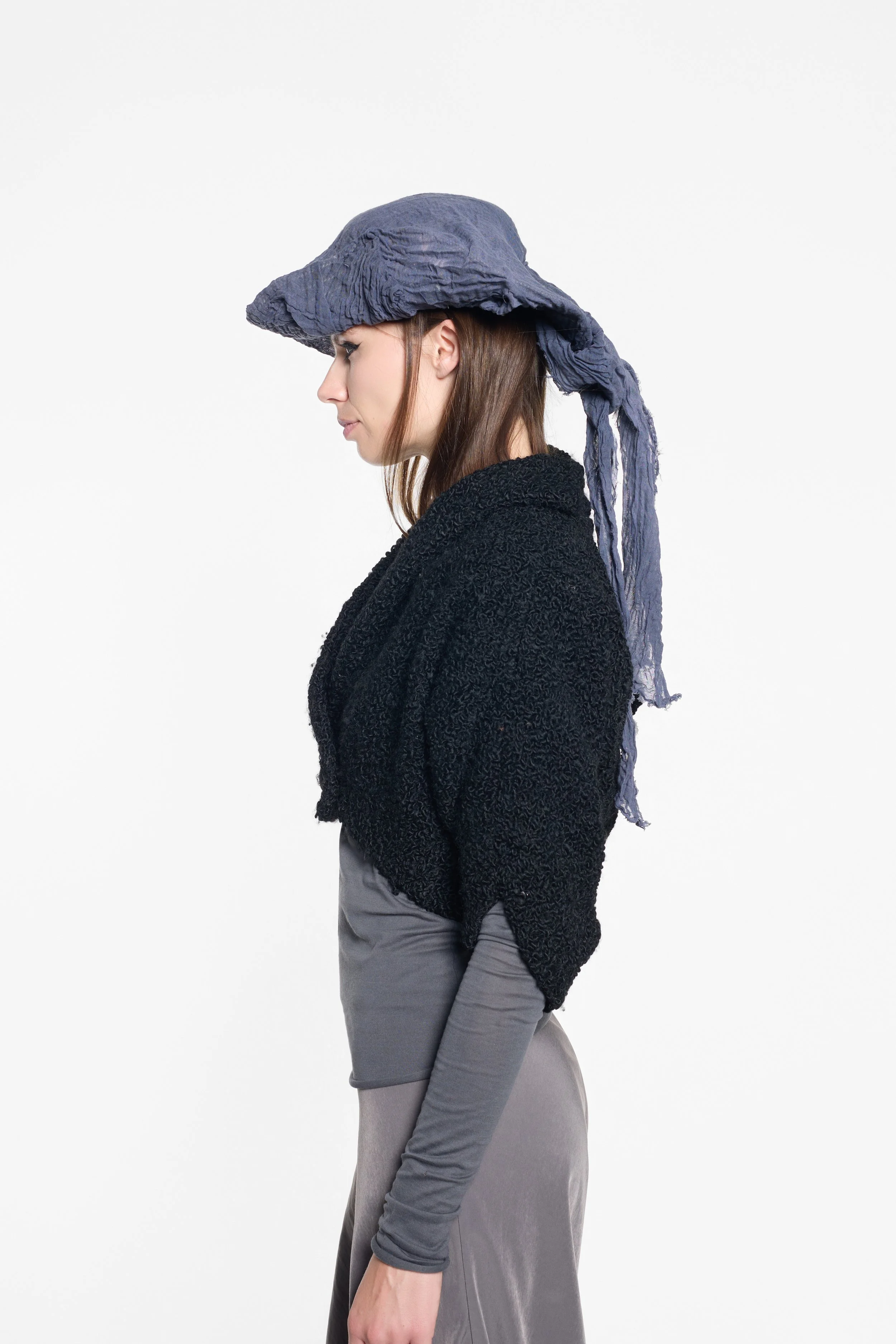 Side view of MVUDSLYDE slate muslin hat with exaggerated three-point shape