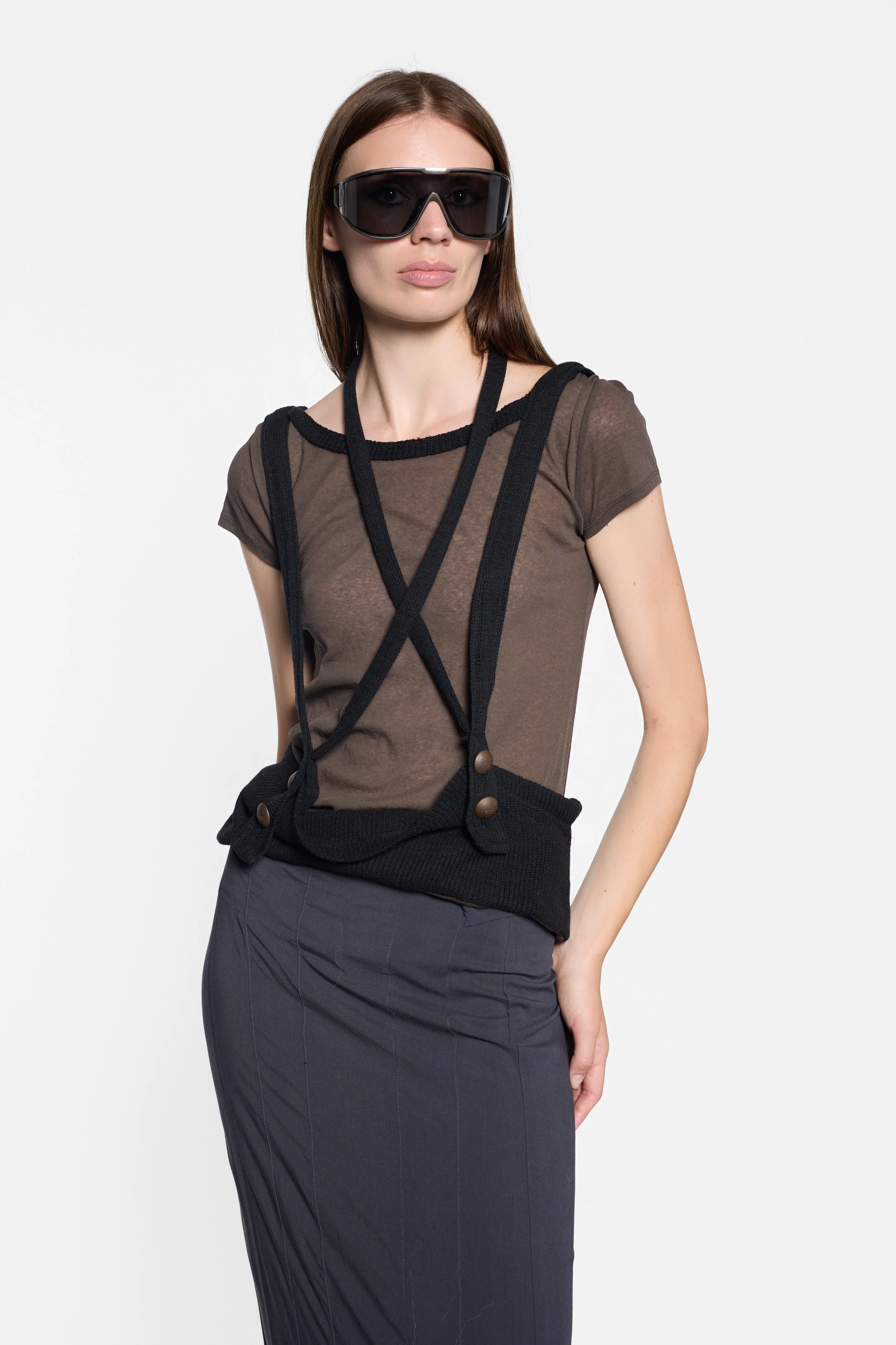 LUXXM sheer brown knit top with layered black straps styled on model