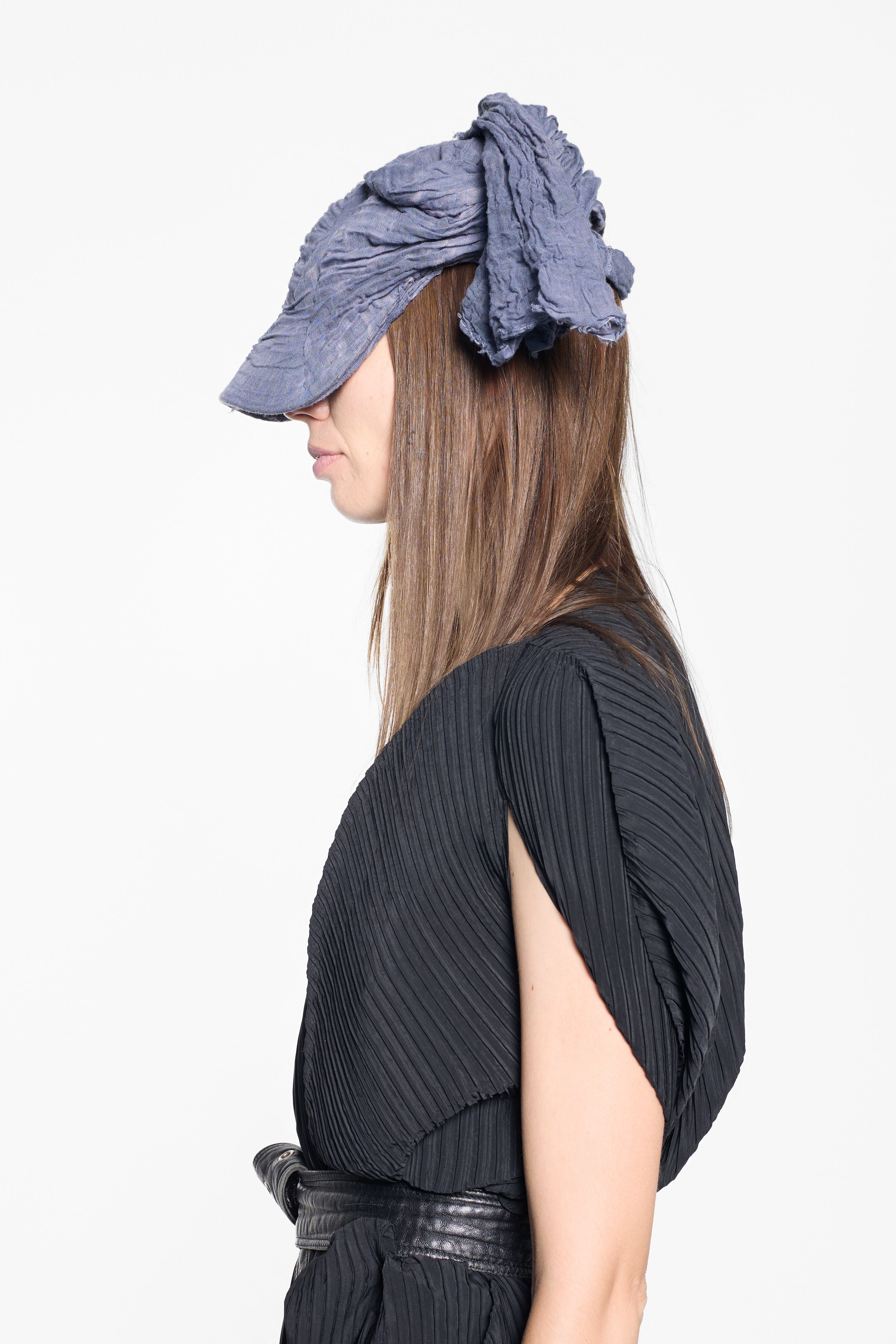 Side view of MVUDSLYDE cotton muslin draped cap