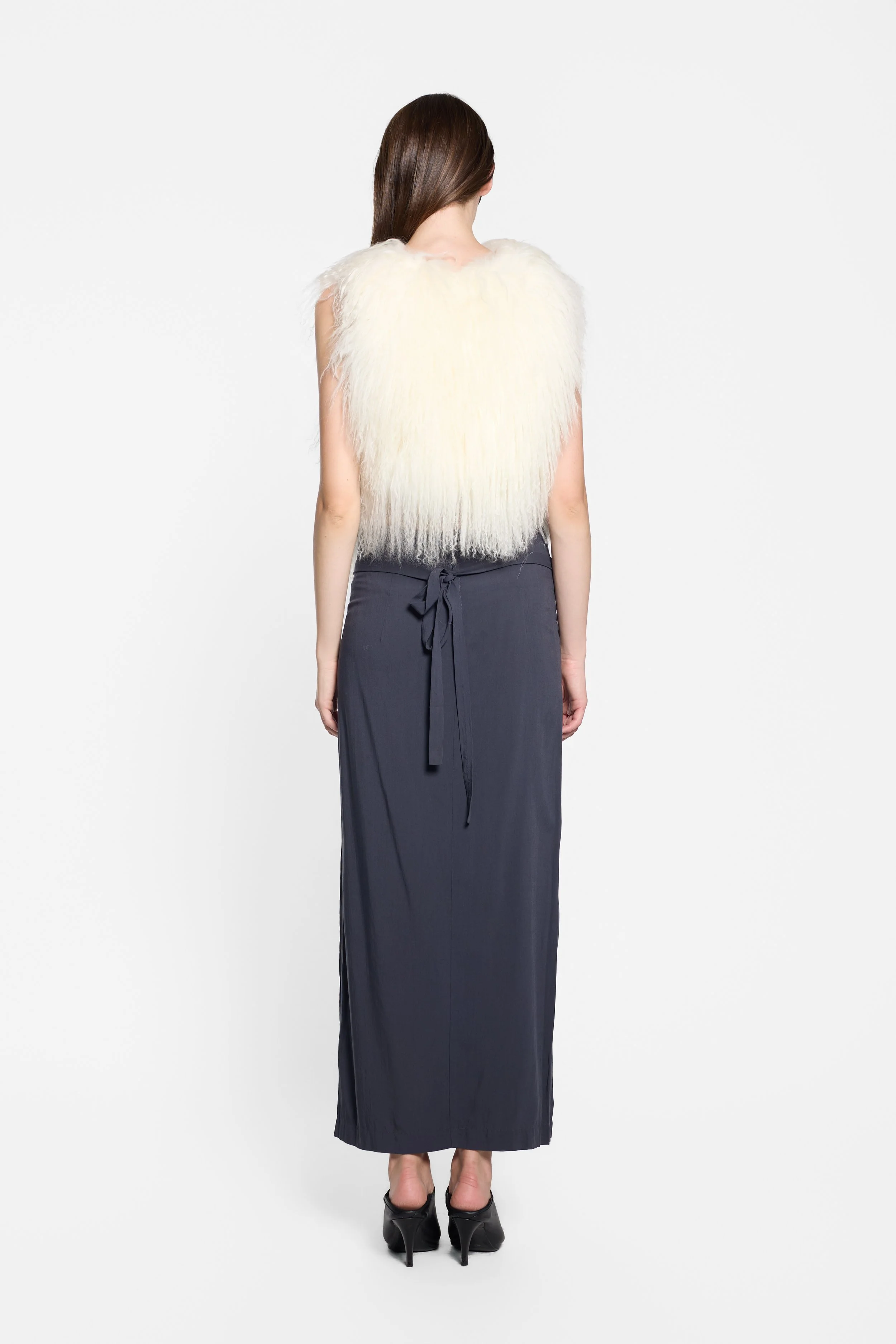 Back view of vintage ivory Mongolian fur vest