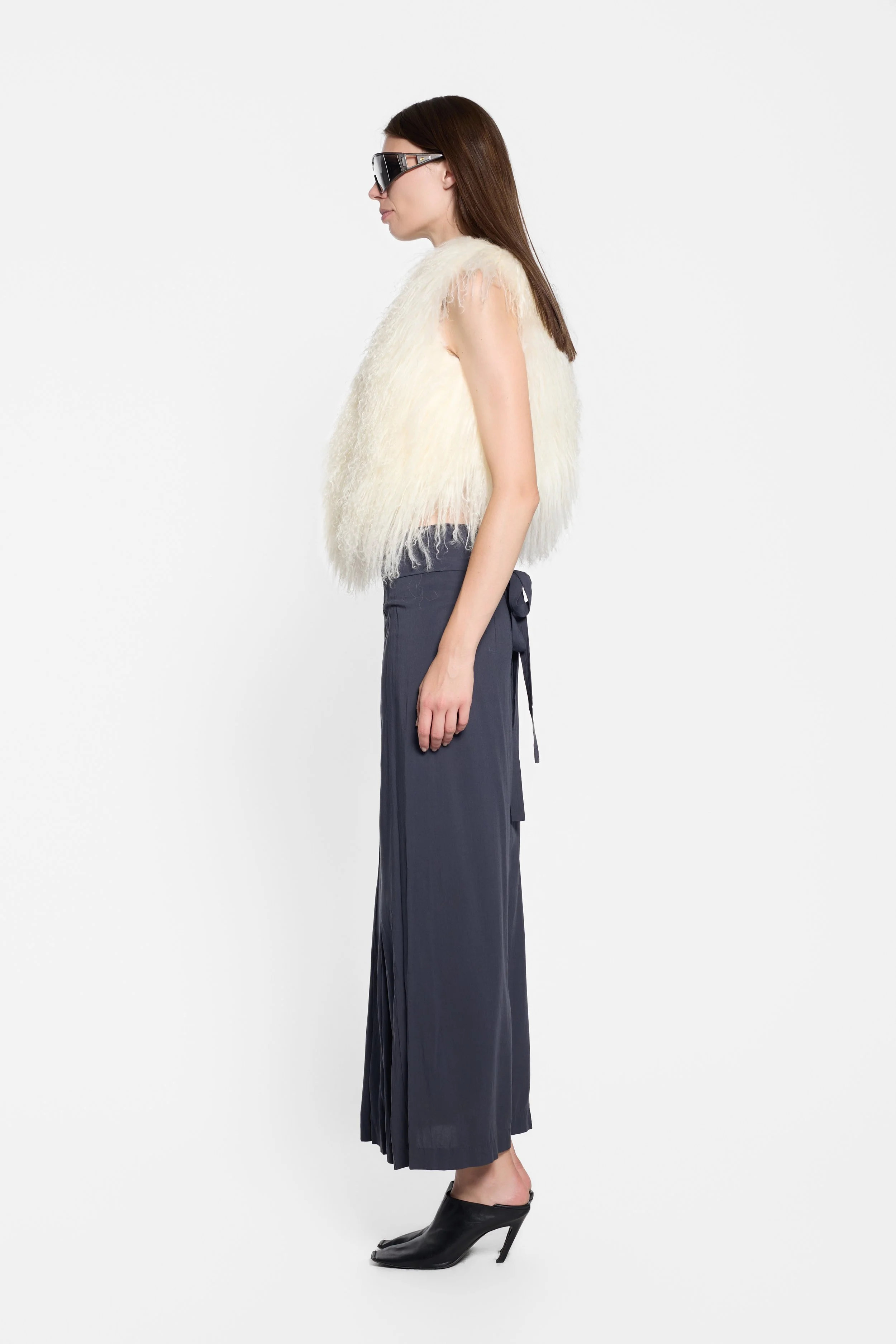 Side view of vintage long-haired Mongolian fur gilet