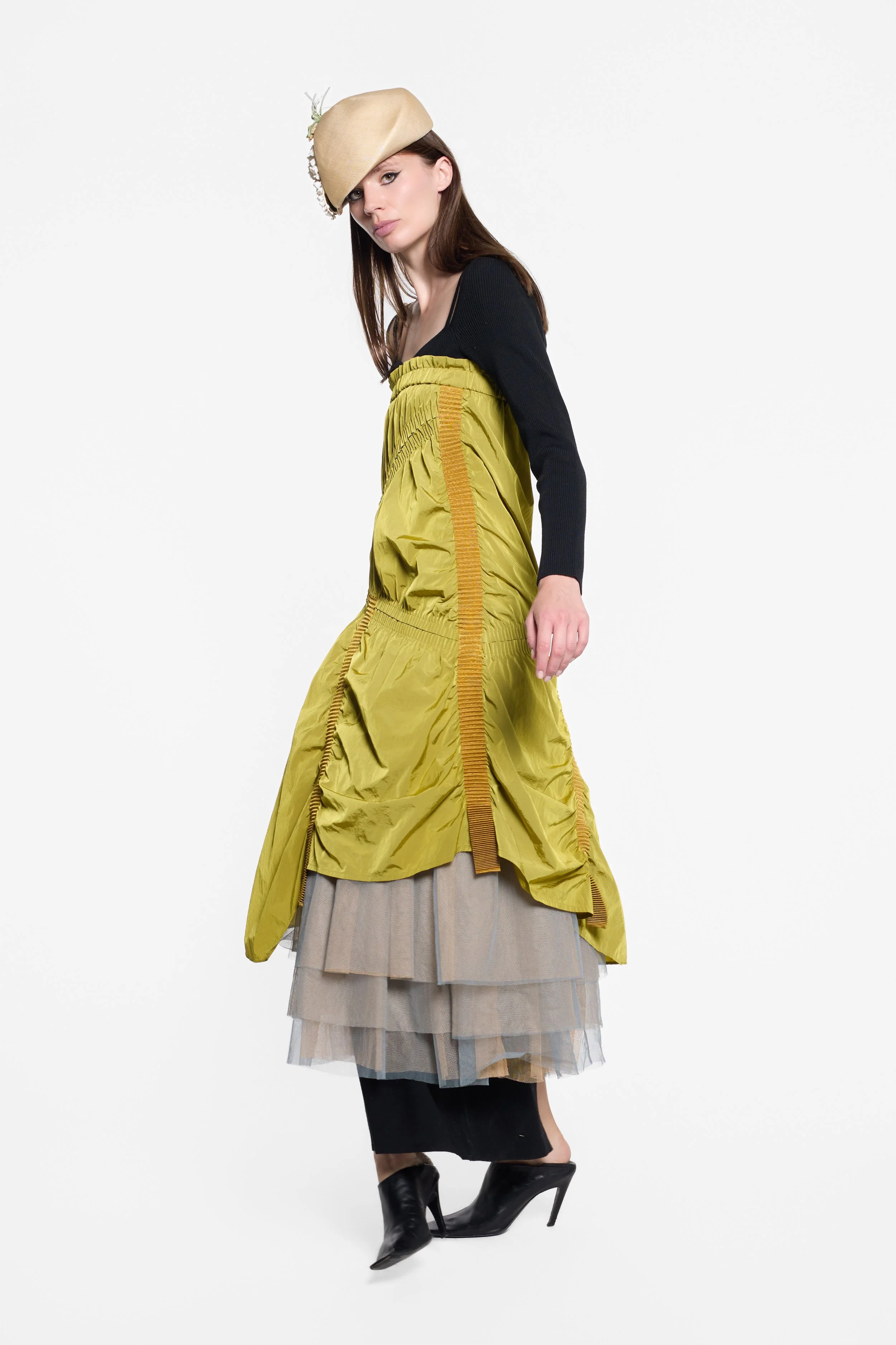 Model wearing UN3D chartreuse asymmetric gathered skirt as dress
