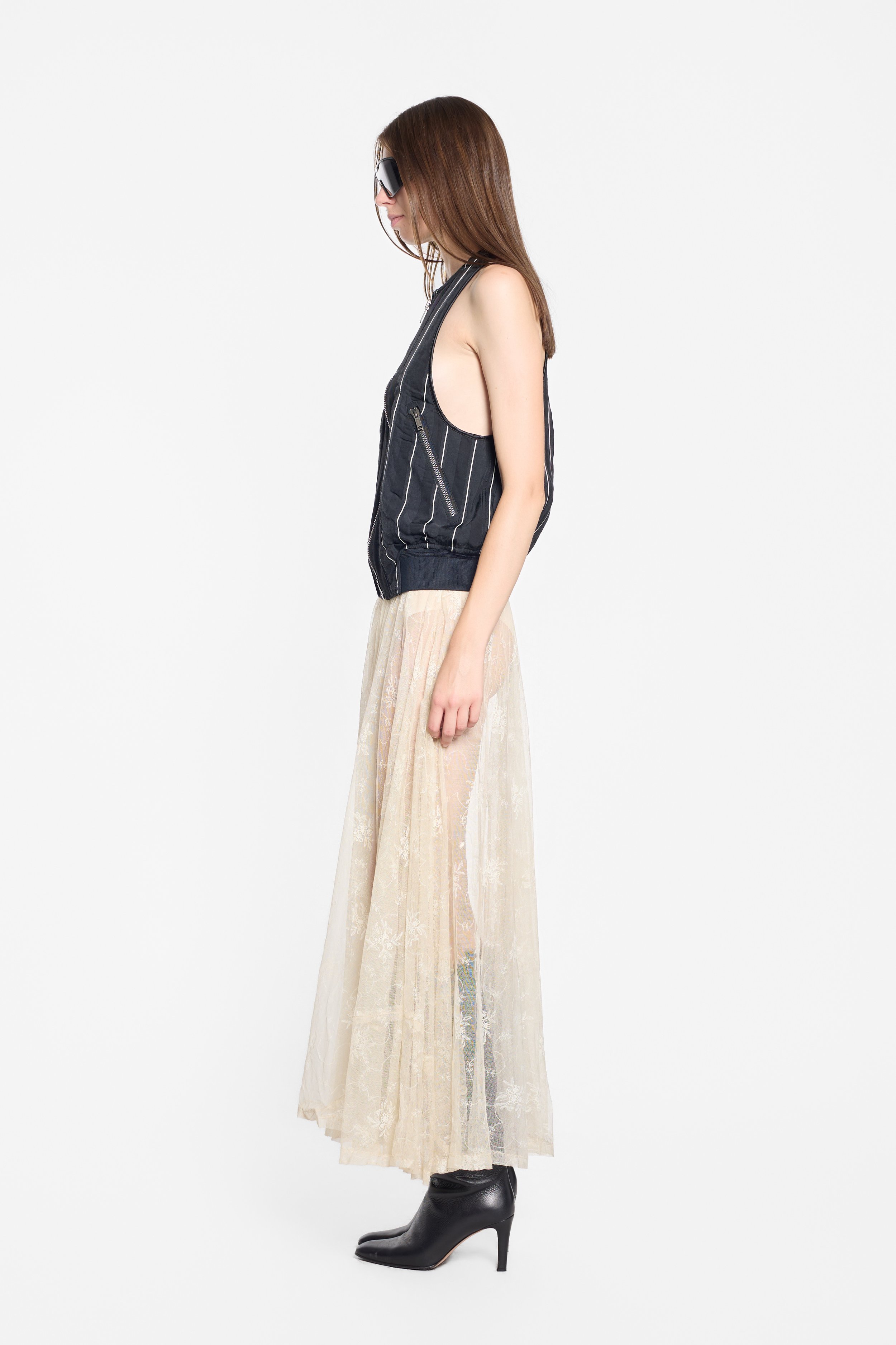 Haider Ackermann SS18 black pinstripe zip vest worn on model, side view