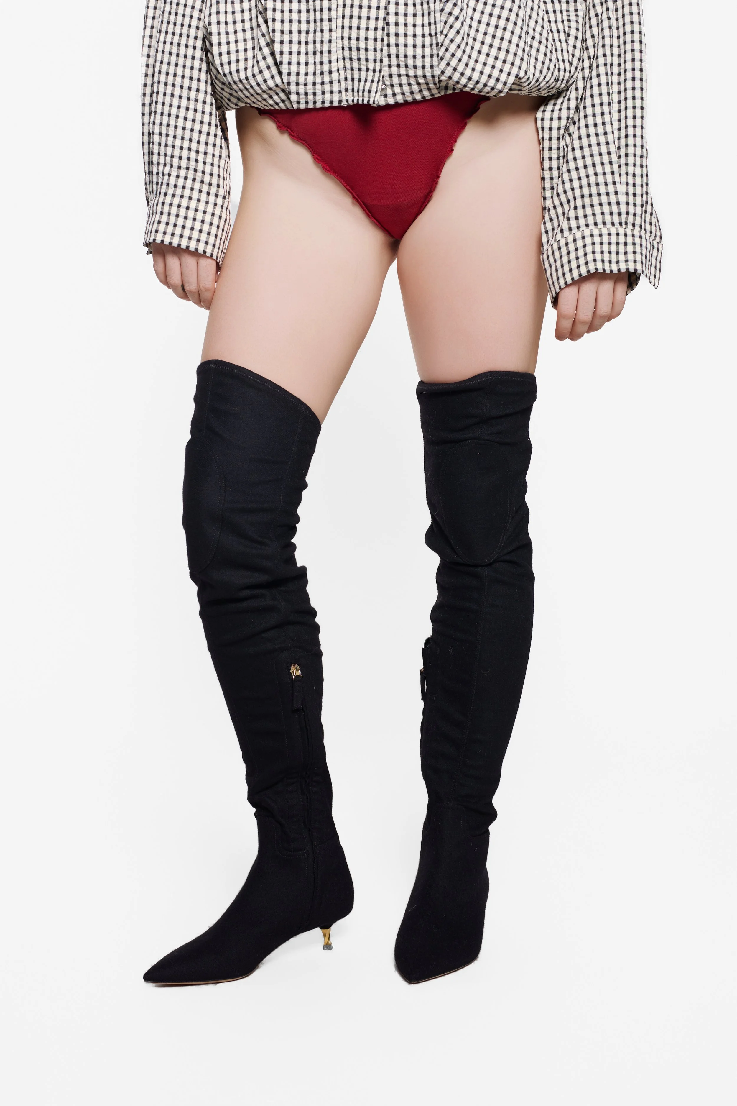 Model wearing Valentino Garavani black suede thigh-high boots