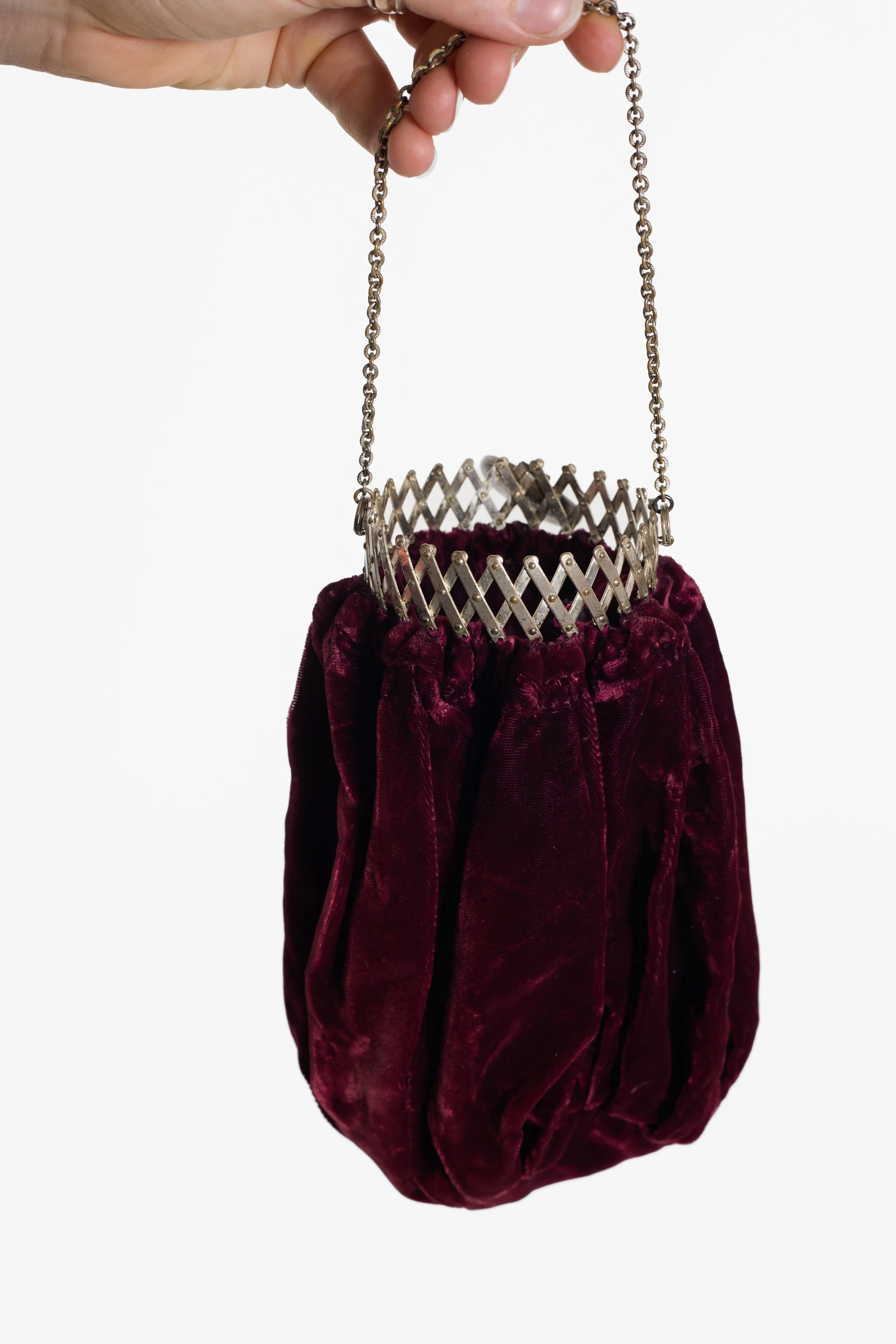 Antique burgundy velvet gate-top purse showing expandable metal frame