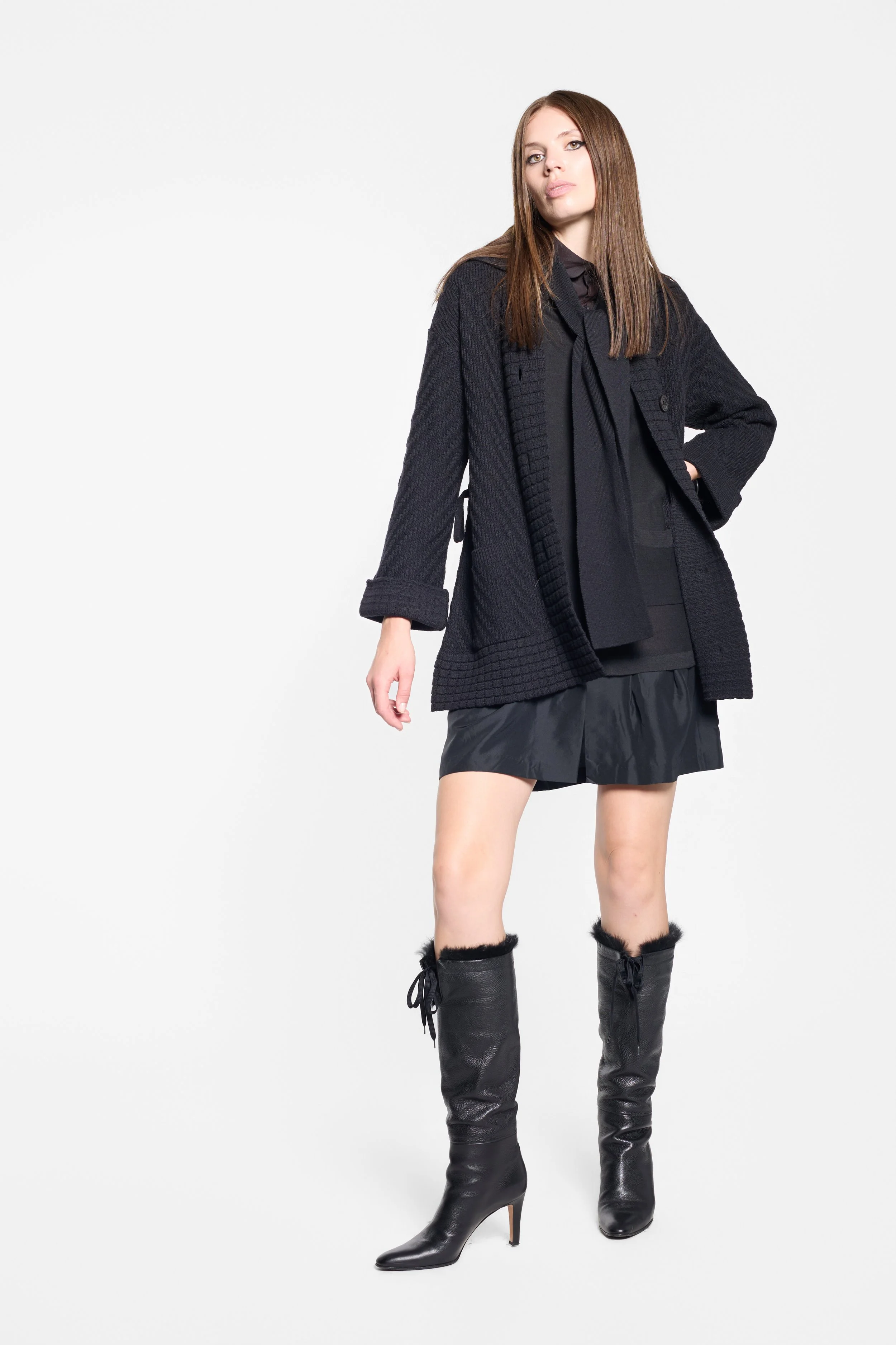Full-length editorial view of Sonia Rykiel black knitted mini dress