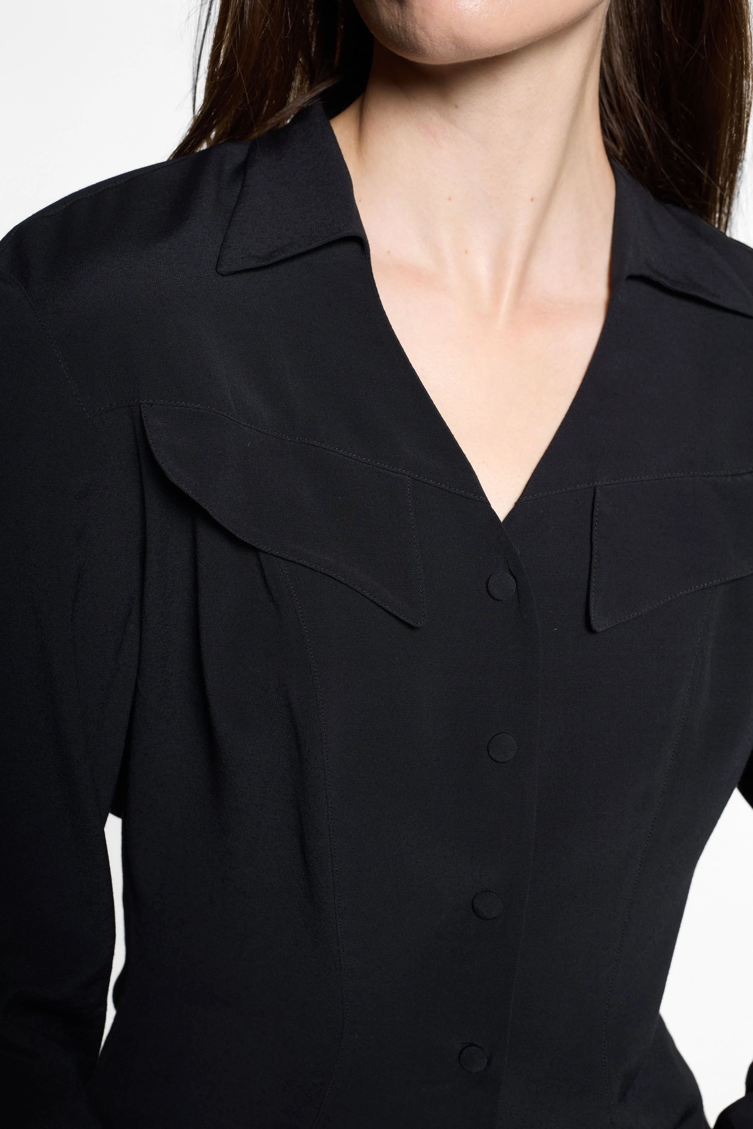 Close-up of wide pointed collar and oversized chest flap panels on Mugler shirt