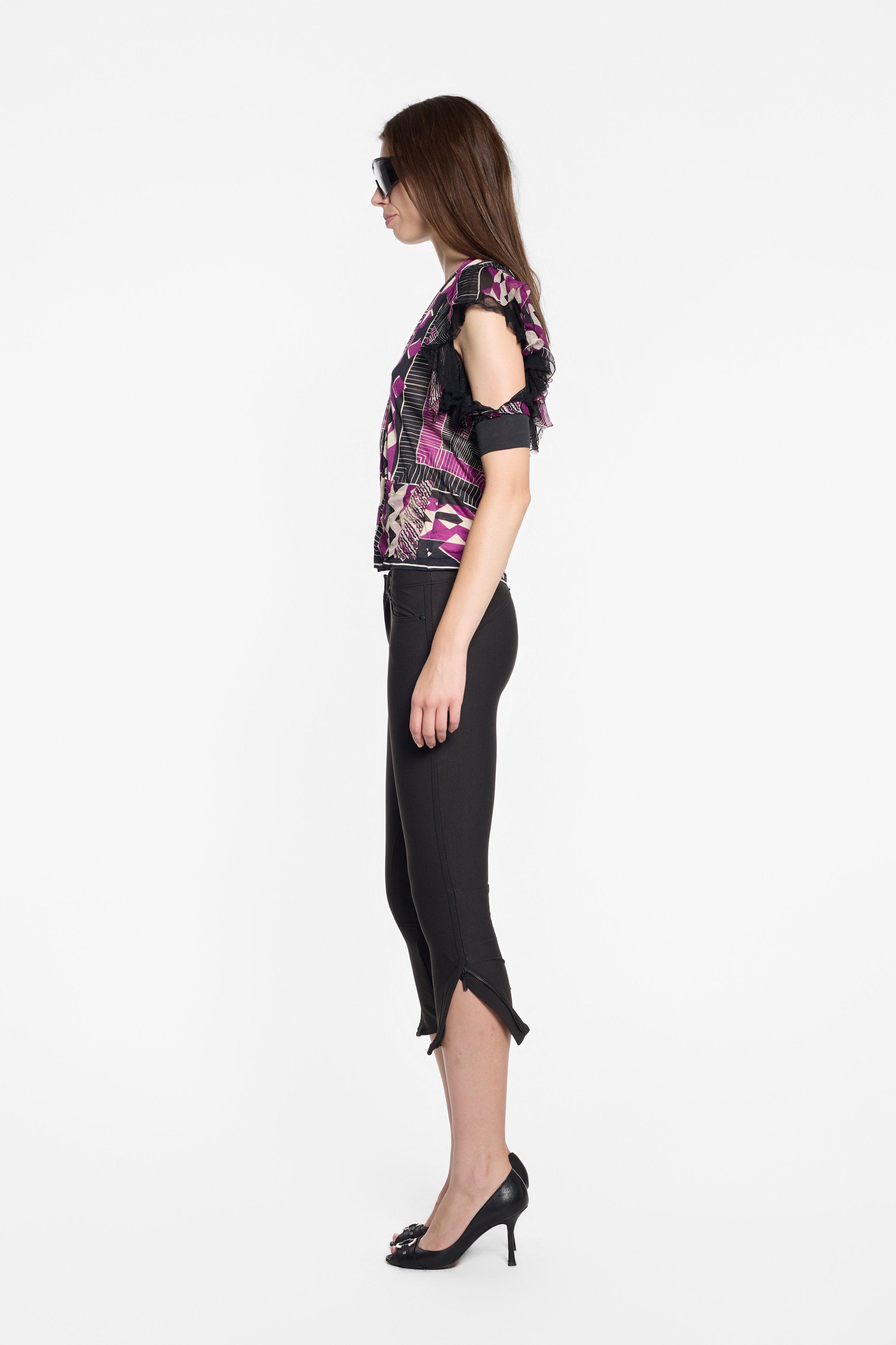 Side view of Jean Paul Gaultier top with cut-out shoulder and ruffled sleeve