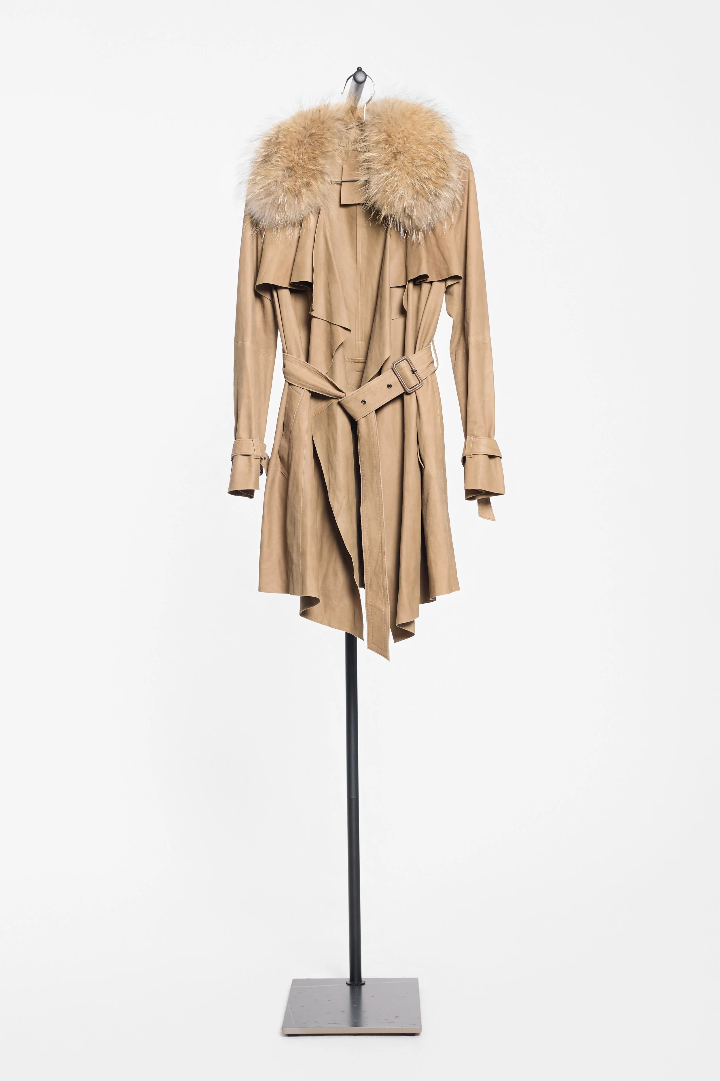 Front view of Rawtus raccoon fur collar trench with draped suede panels