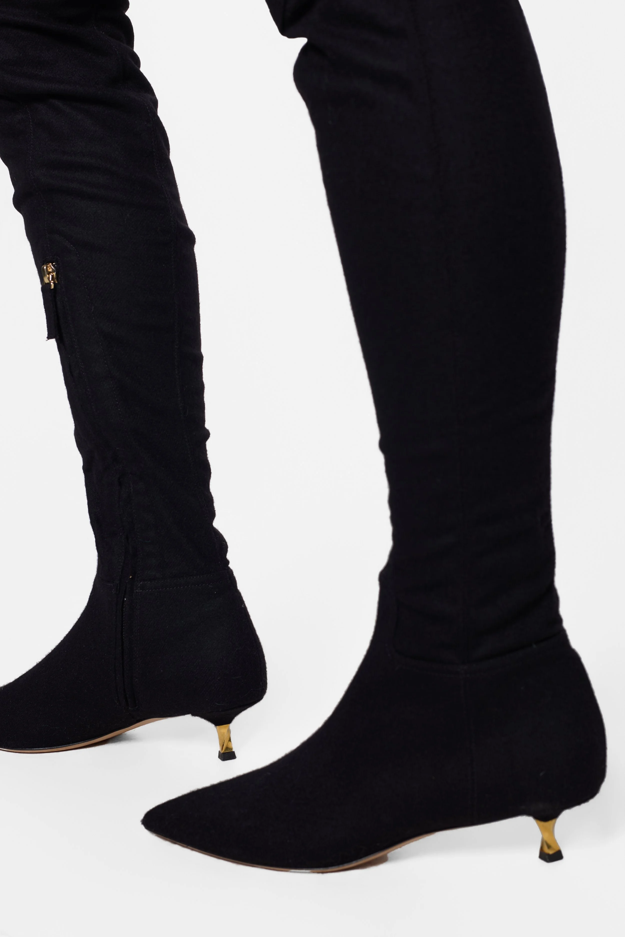 Model wearing Valentino Garavani black suede thigh-high boots